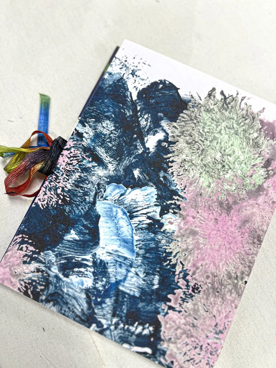 Handmade book made with blue/pink/white abstract floral design and ribbon closure