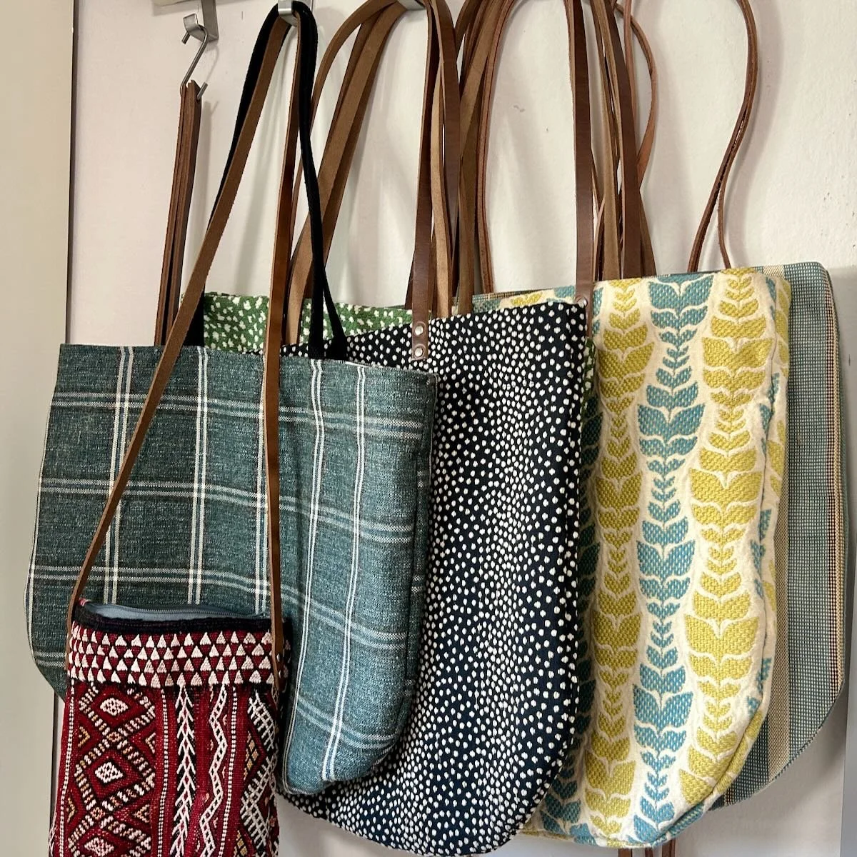 Stack of five fabric tote bags