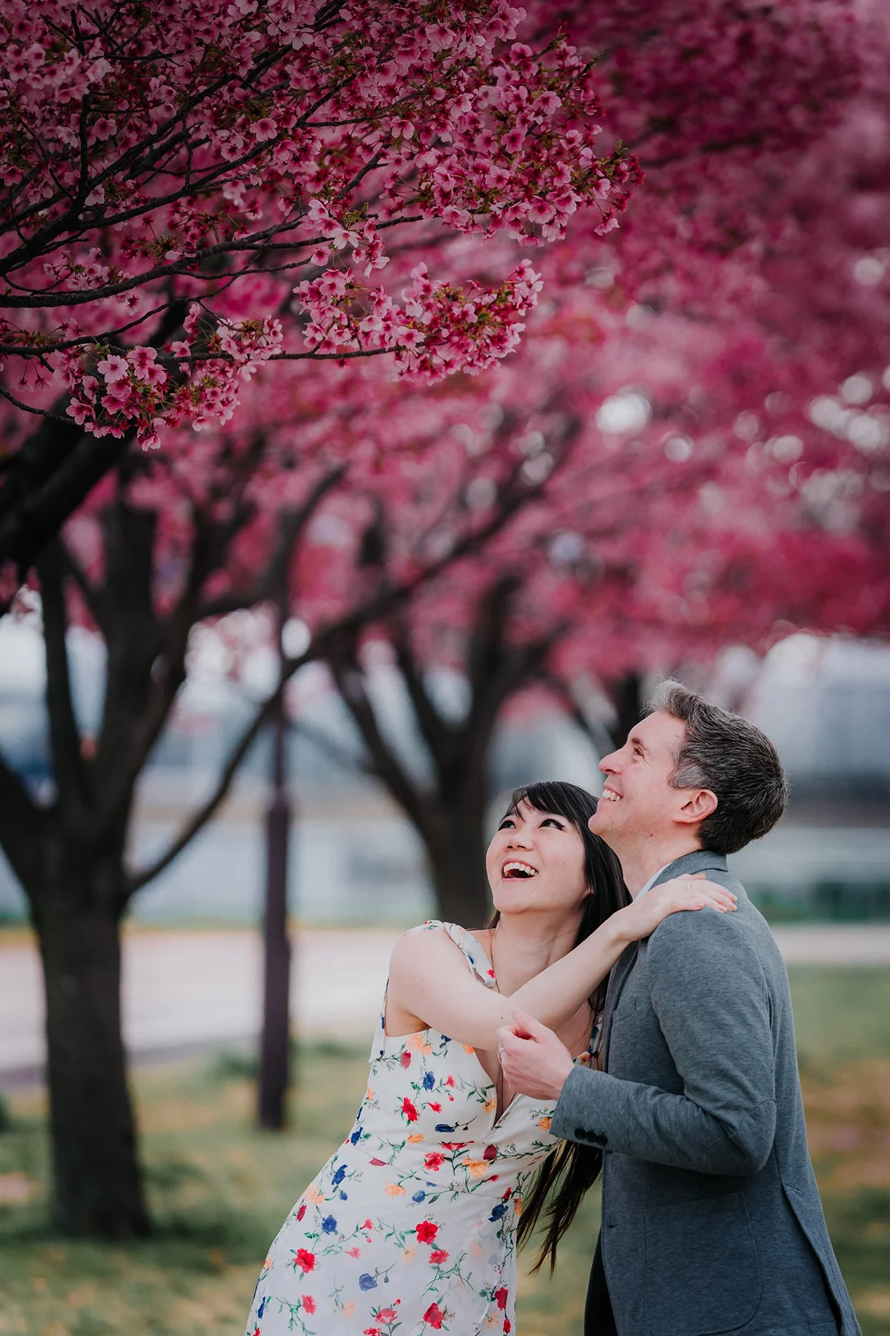 Couple enjoying cherry blossom season in Tokyo during engagement photoshoot 