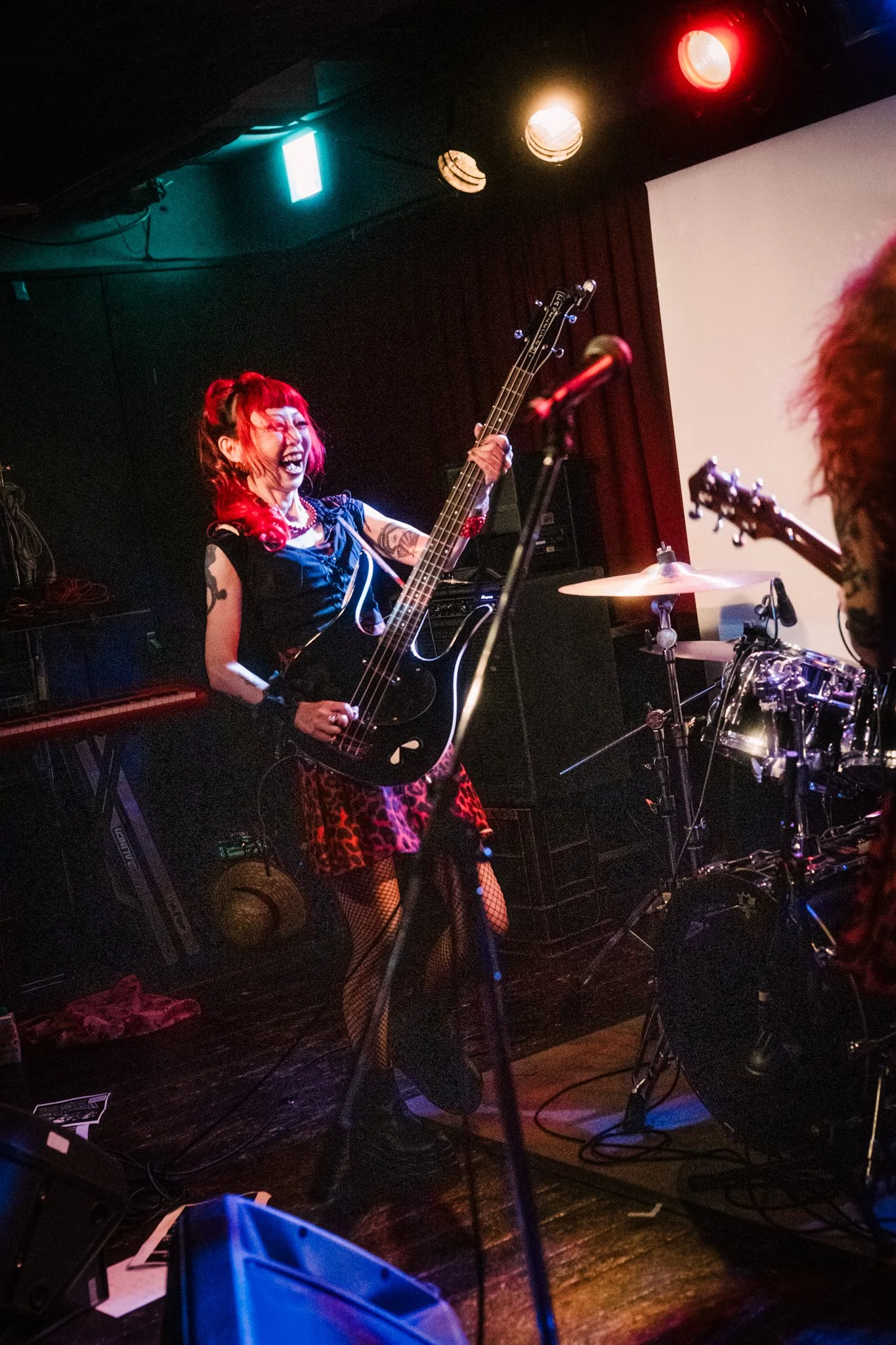 Female band member performing at live show in Tokyo