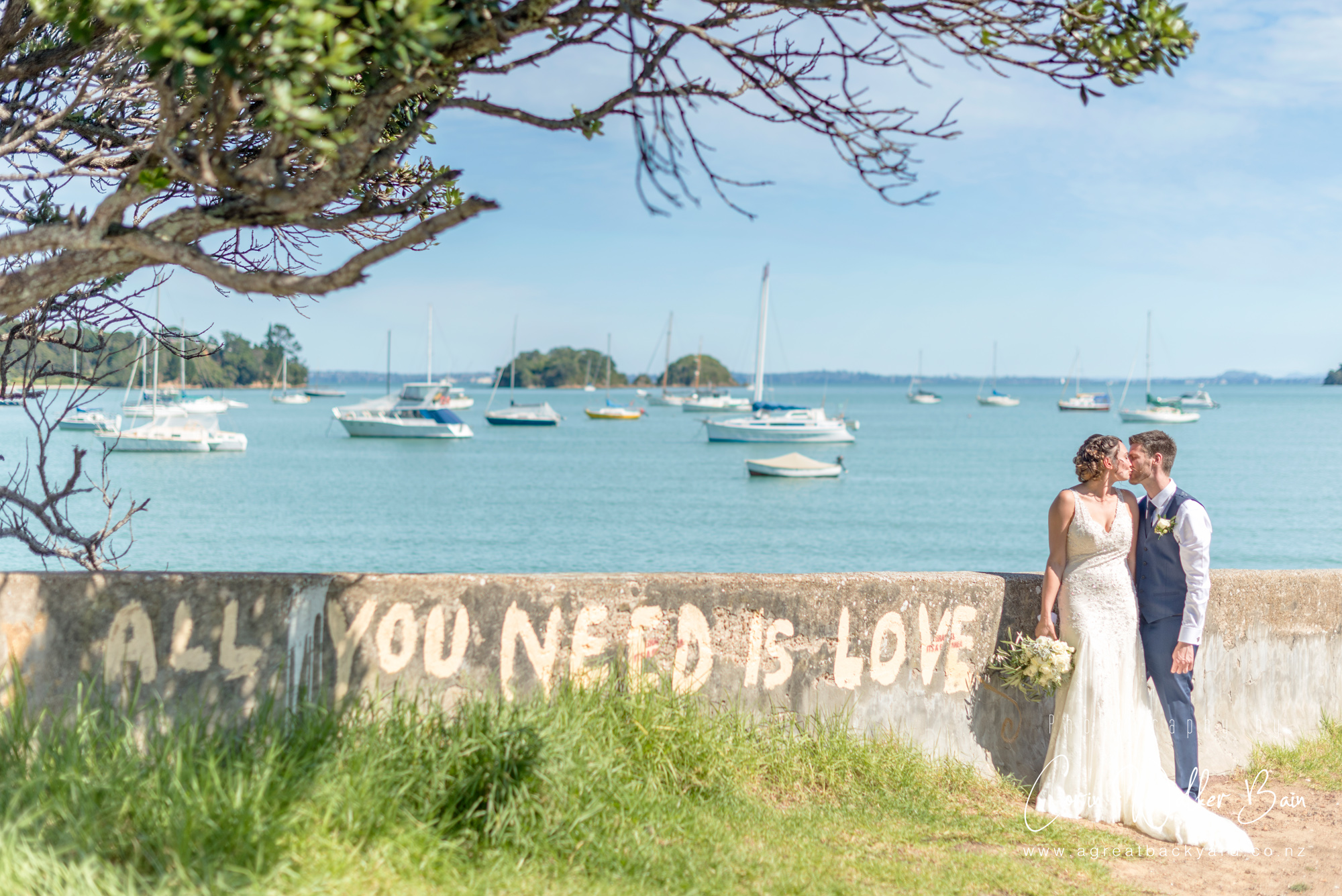 On location at Andy and Emma's Waiheke Island wedding by New Zealand wedding photographer Corin Walker Bain of a great backyard