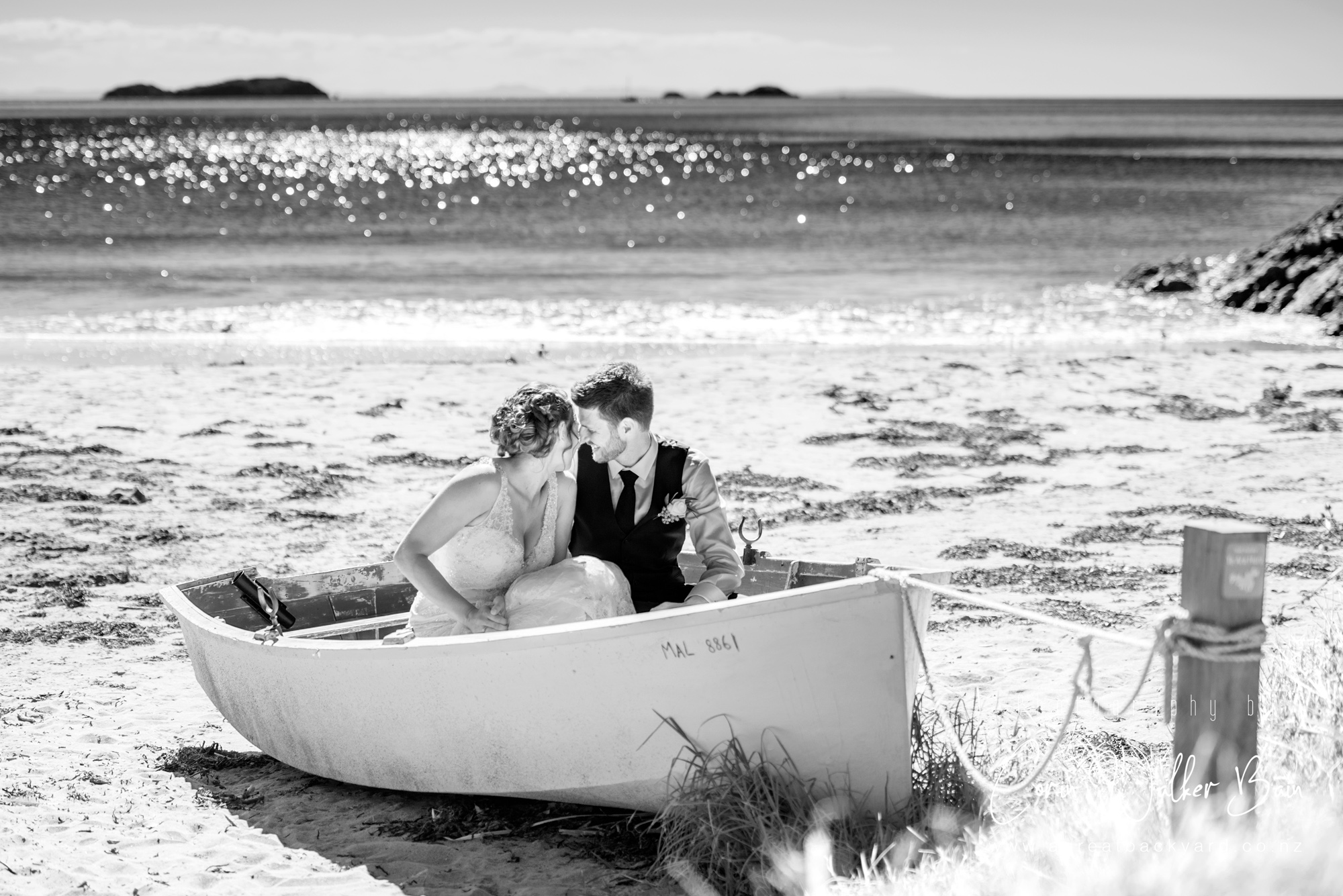 Giggles at Andy and Emma's Waiheke Island wedding by New Zealand wedding photographer Corin Walker Bain of a great backyard