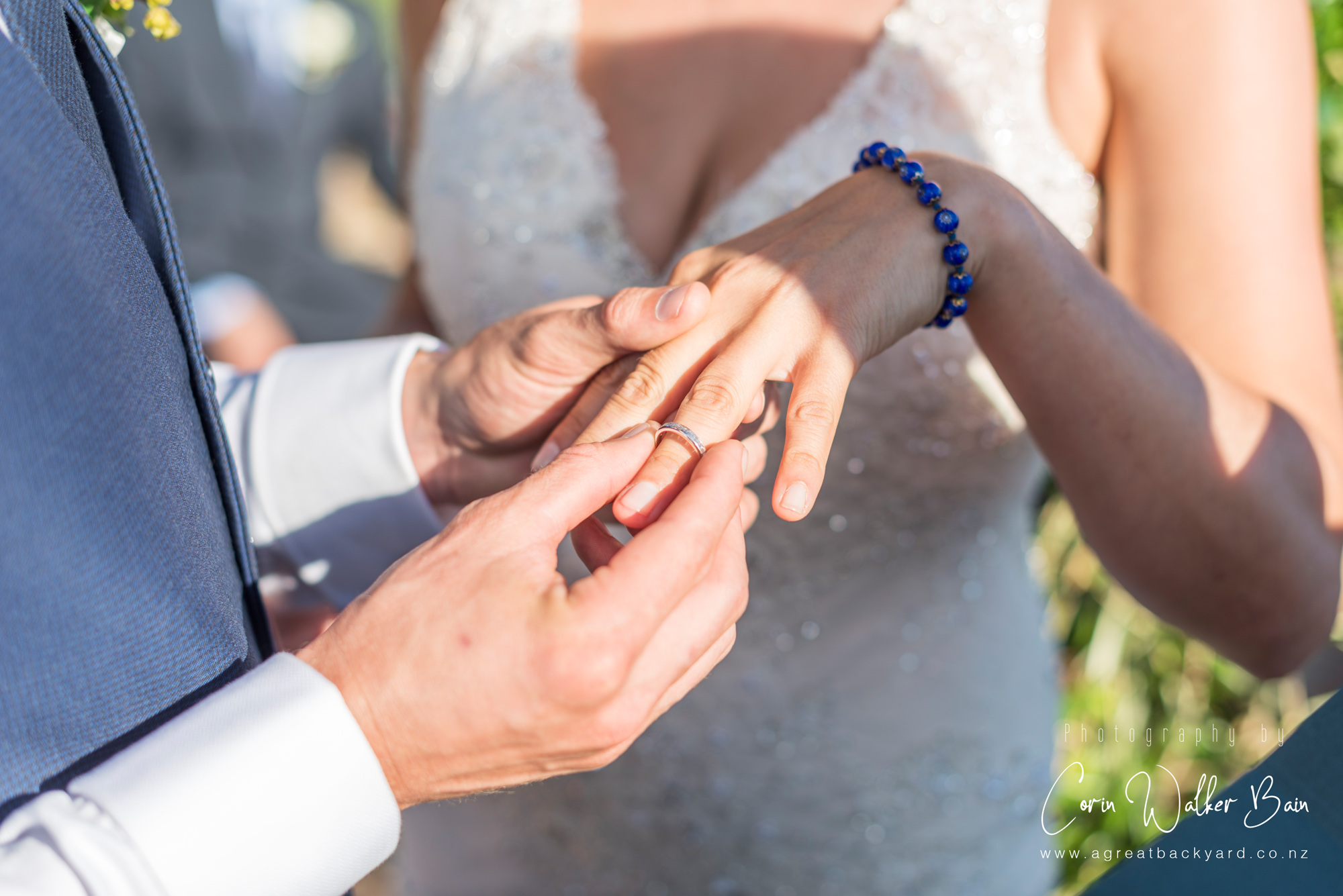 With this ring at Andy and Emma's Waiheke Island wedding by New Zealand wedding photographer Corin Walker Bain of a great backyard