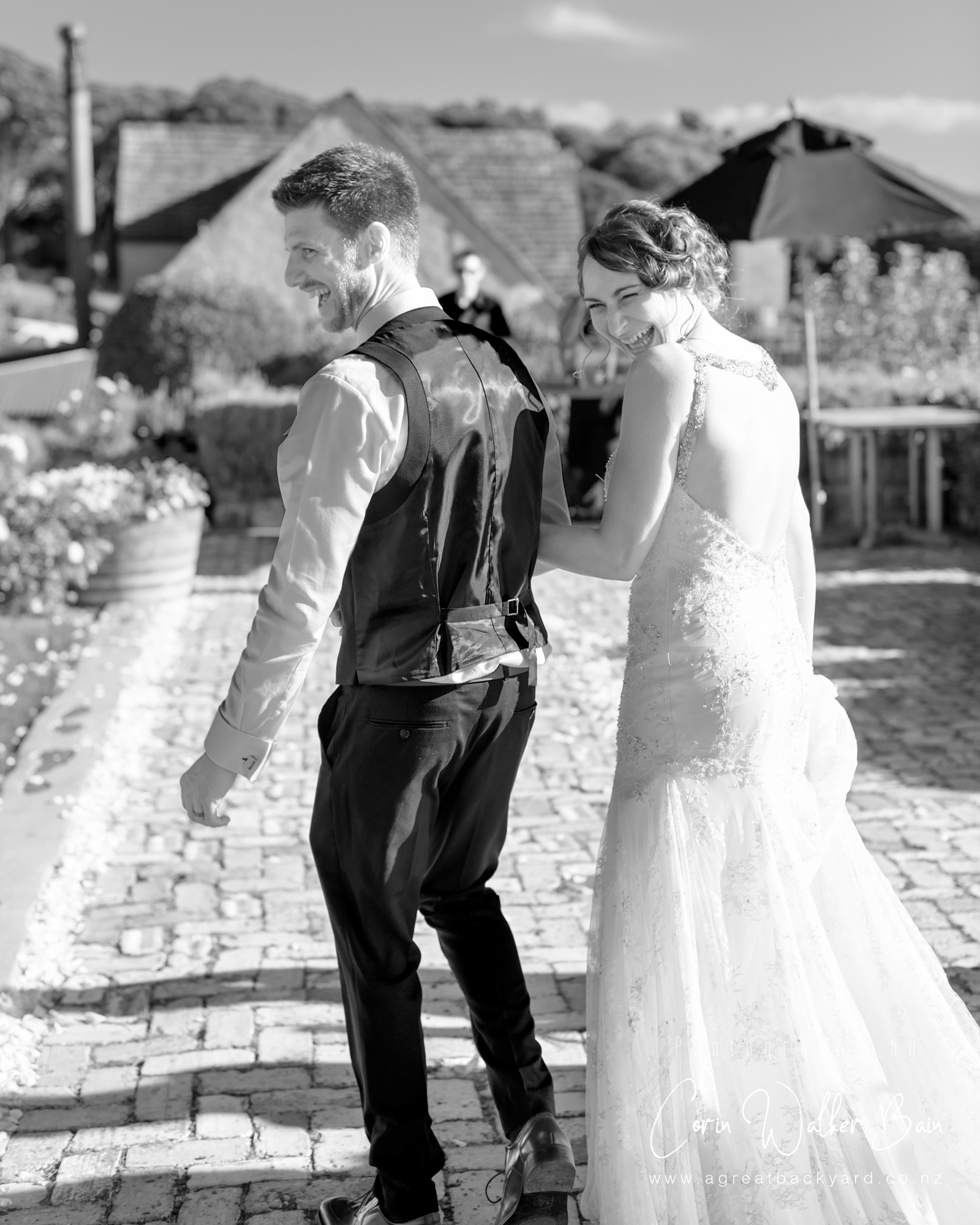 Ceremony giggles at Andy and Emma's Waiheke Island wedding by New Zealand wedding photographer Corin Walker Bain of a great backyard