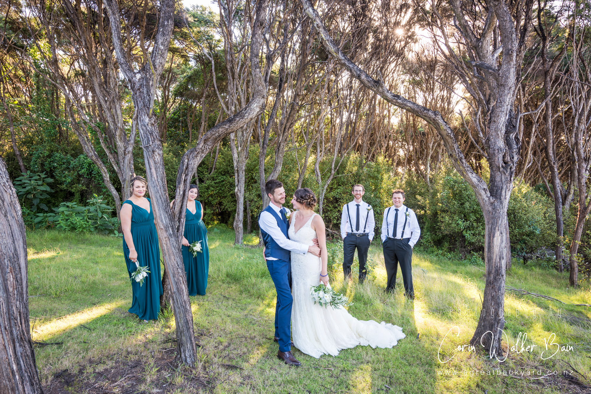 Bridal party at Andy and Emma's Waiheke Island wedding by New Zealand wedding photographer Corin Walker Bain of a great backyard