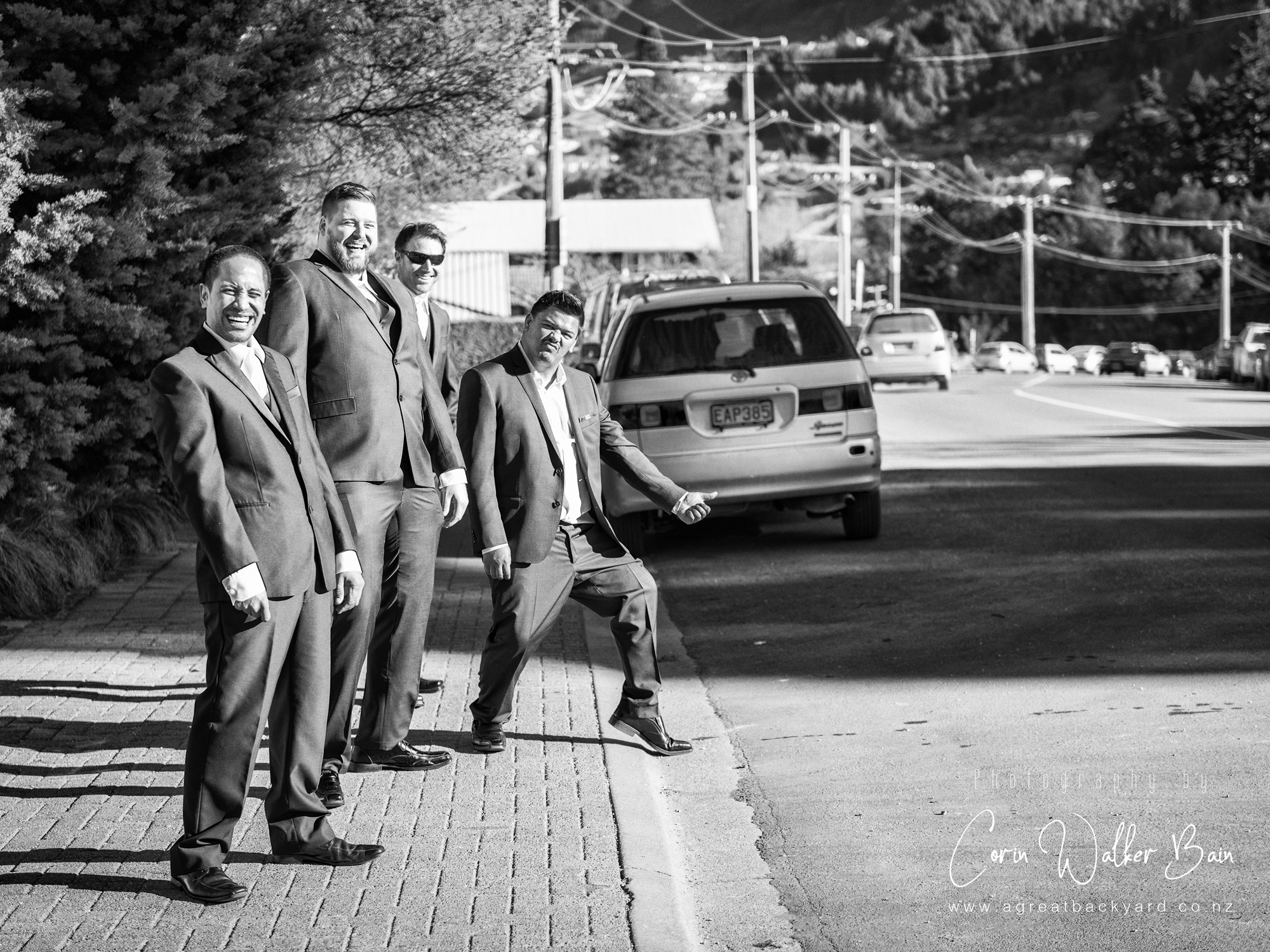 Catching a lift, Jah and Teri's Queenstown wedding by New Zealand wedding photographer Corin Walker Bain of a great backyard