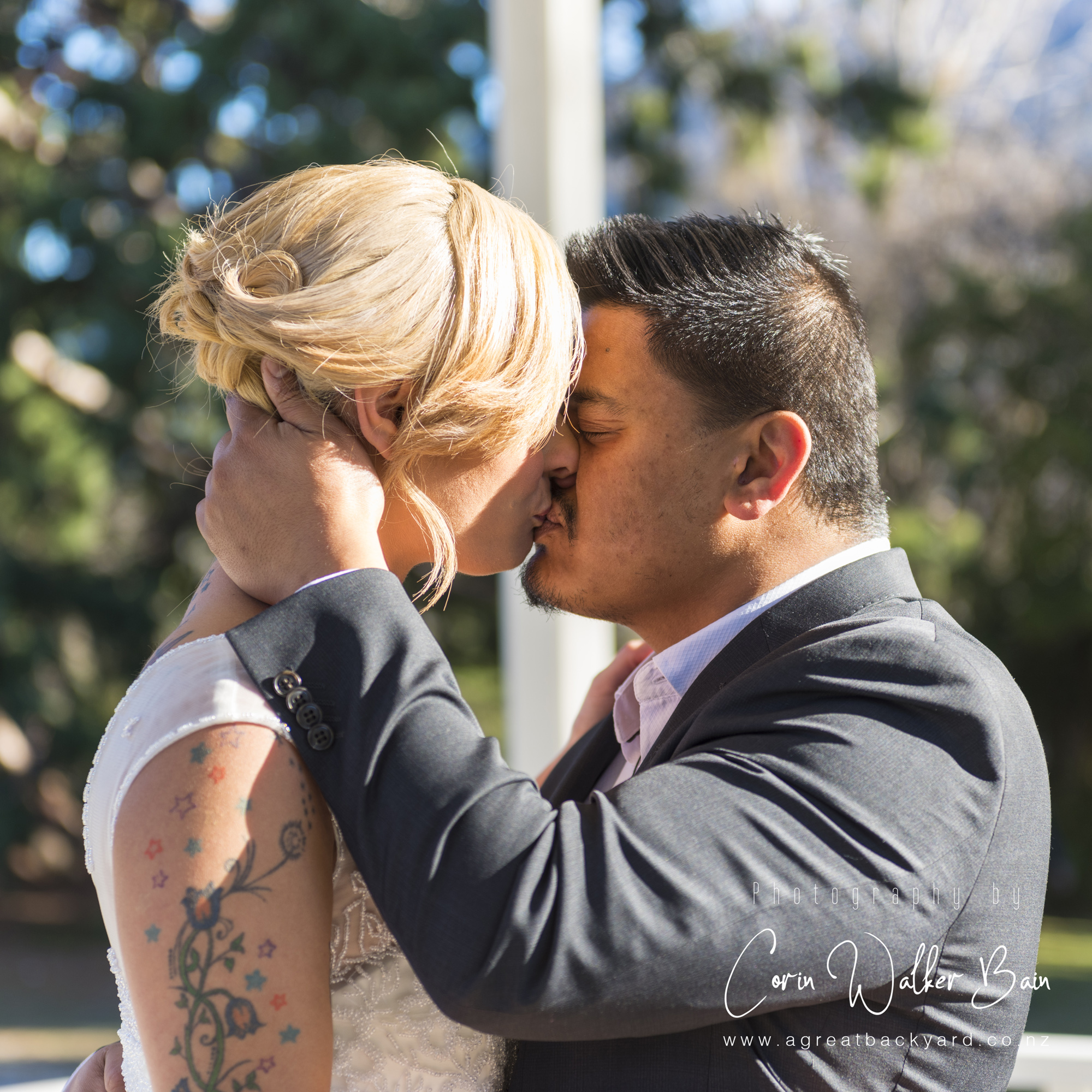 The kiss, Jah and Teri's Queenstown wedding by New Zealand wedding photographer Corin Walker Bain of a great backyard