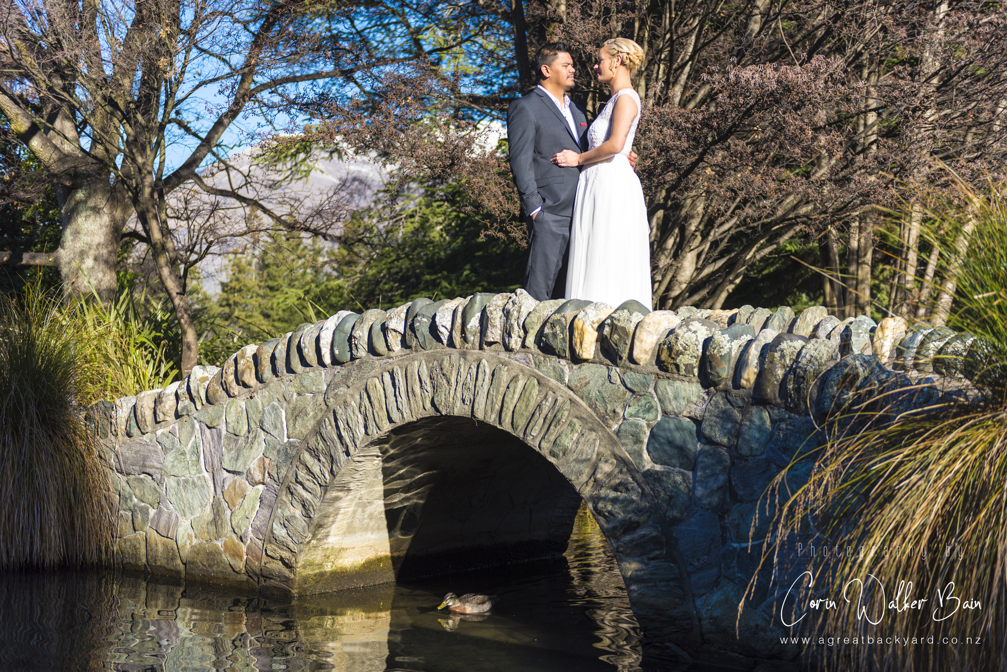 Bride and groom, Jah and Teri's Queenstown wedding by New Zealand wedding photographer Corin Walker Bain of a great backyard