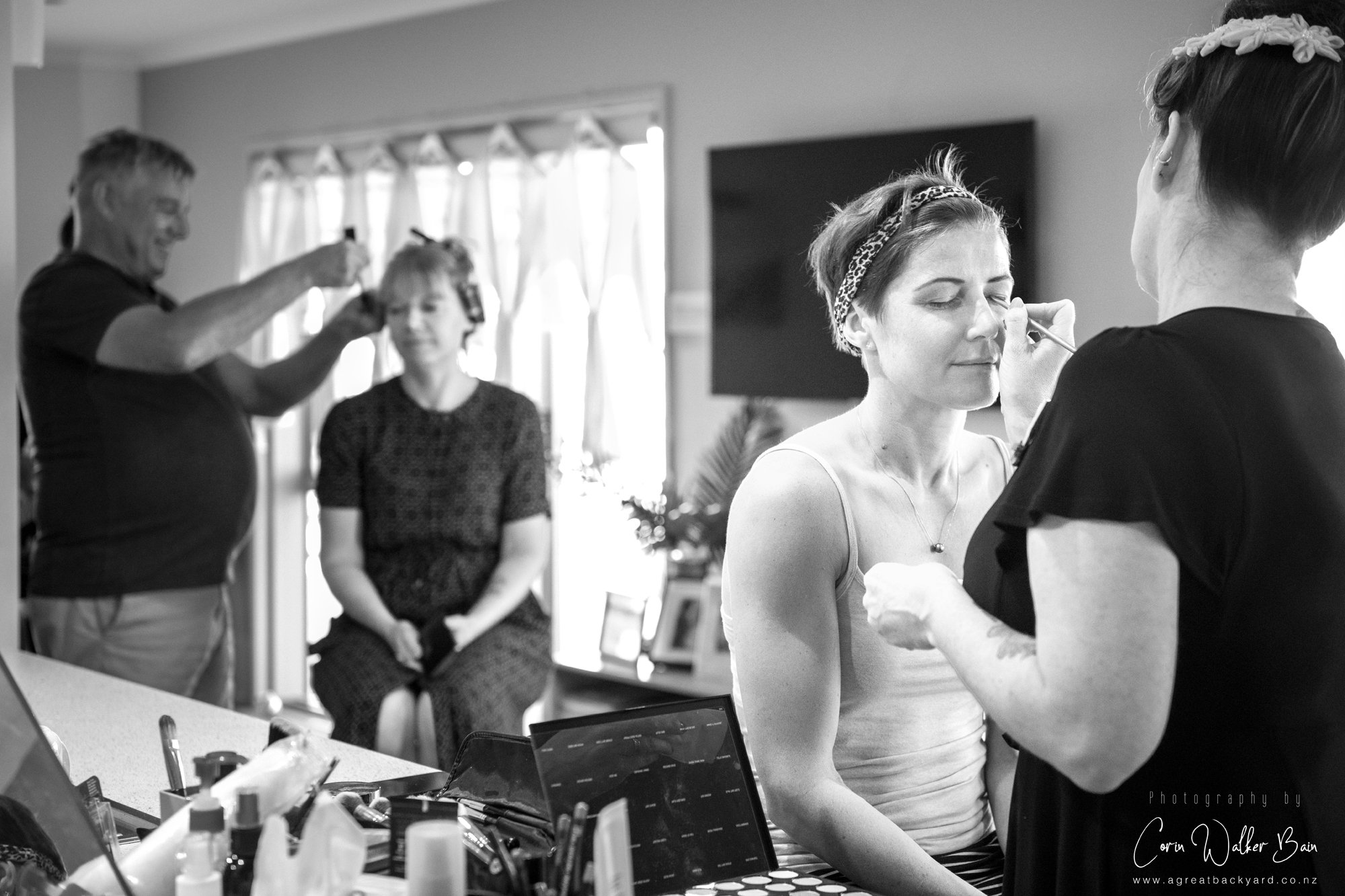 Bride getting hair and makeup done