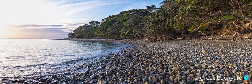 Panoramic view of a pebbly Coromandel beach by Corin Walker Bain | a great backyard