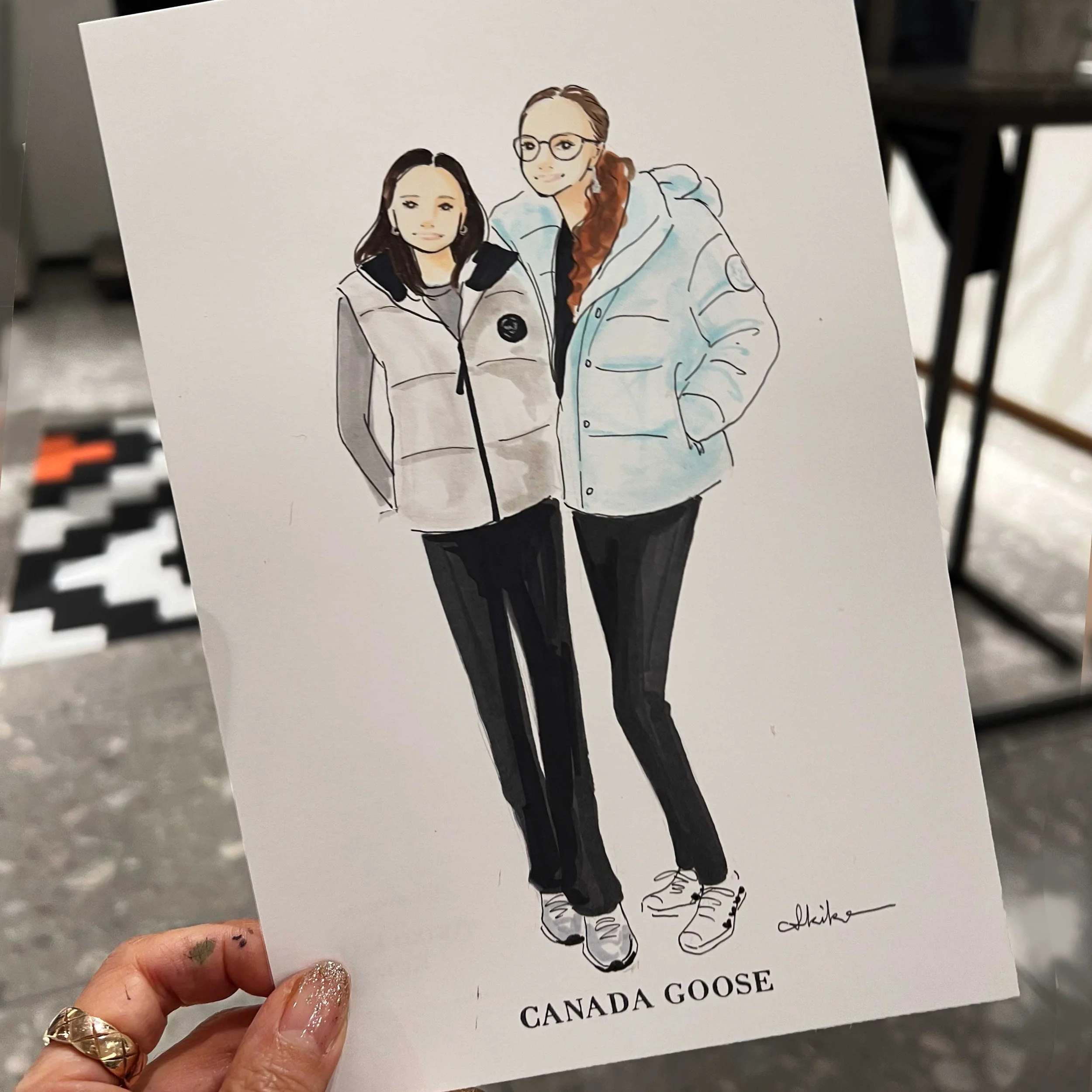 fashion illustration of two women wearing Canada Goose Jacket