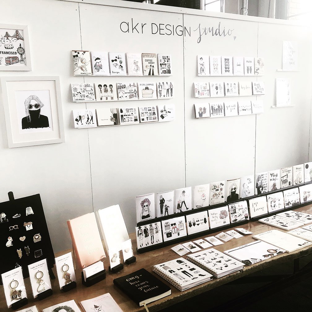 akrDesignStudio at a tradeshow displayed greeting cards and gifts