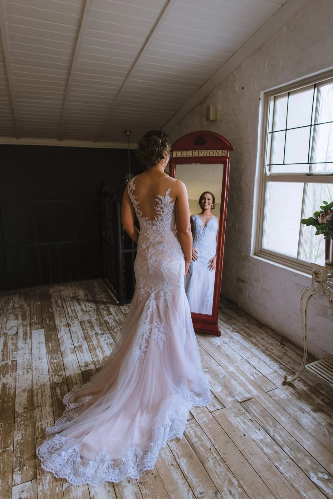 Bride in custom fitted lace wedding dress by Bridal Alchemy in Johannesburg