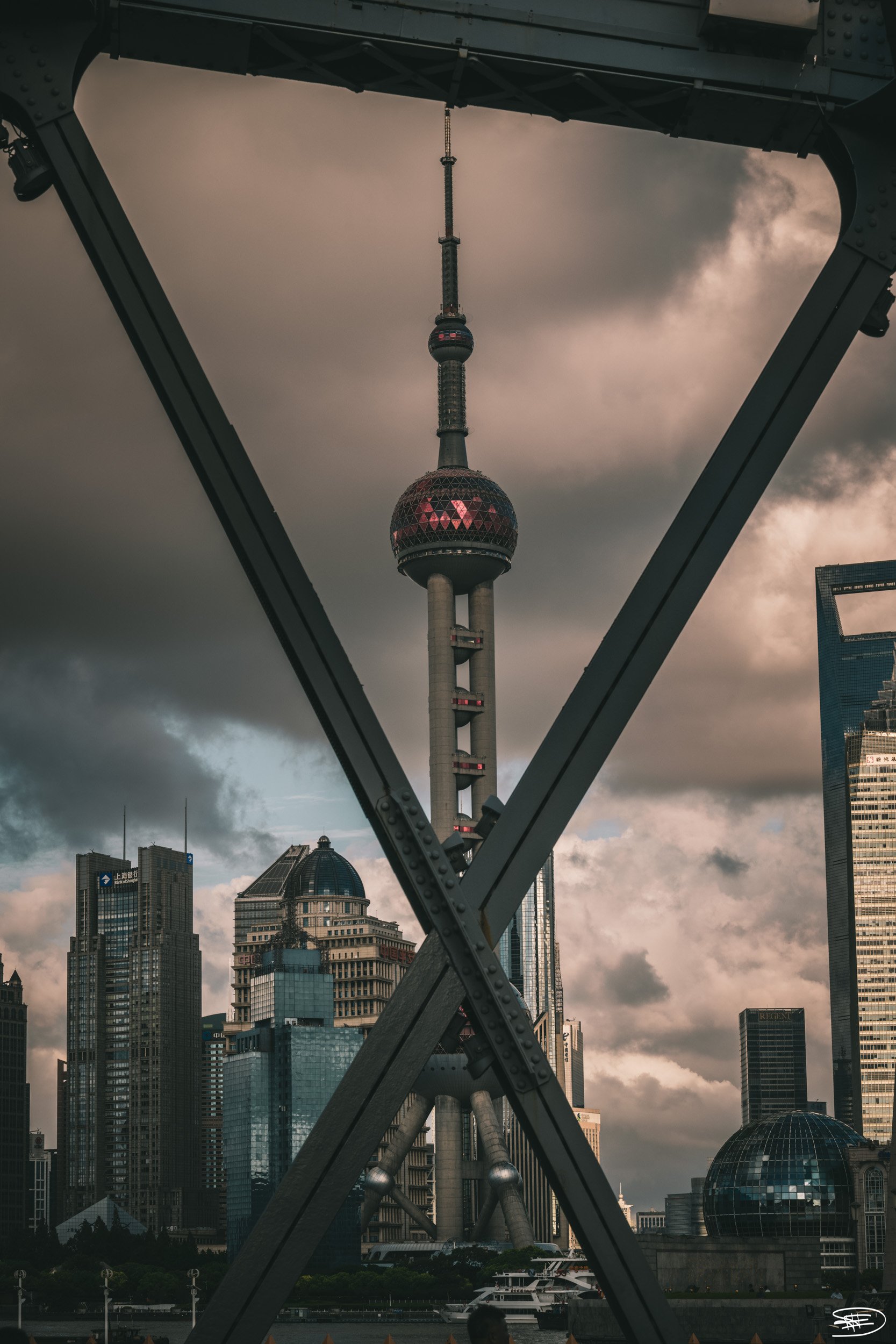 Framed by the iconic bridge, Shanghai's skyline emerges from the summer clouds

Location details: Shanghai, China

Technical information:
* Exposure: ¹⁄₁₀₀ sec
* Aperture: ƒ / 11
* Focal length: 70 mm
* Lens: NIKKOR Z 24-70mm f/2.8 S
* ISO: 160
* Cam