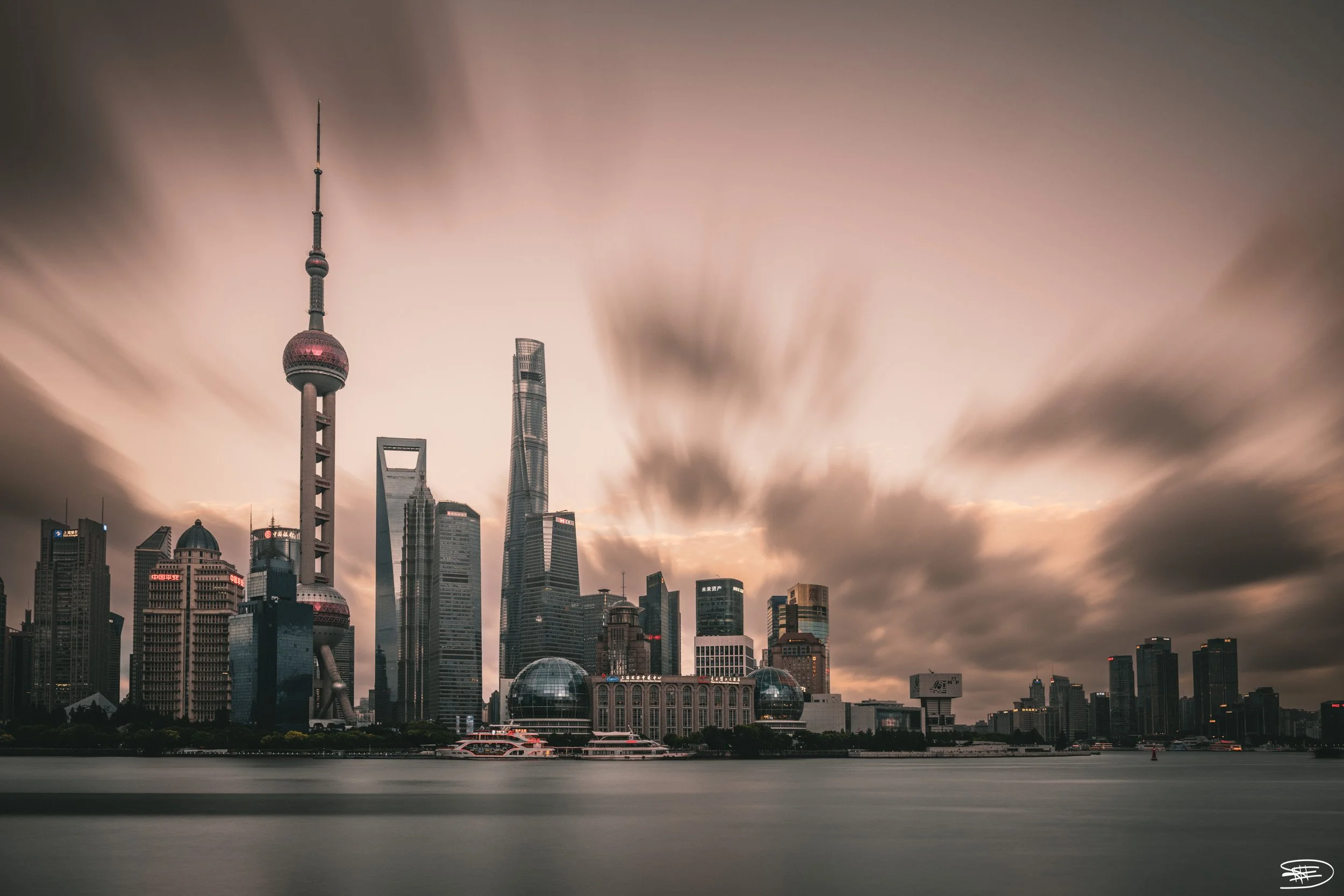 Shanghai's skyline bathed in twilight hues

Location details: Shanghai, China

Technical information:
* Exposure: 30.0 sec
* Aperture: ƒ / 9.0
* Focal length: 27 mm
* Lens: NIKKOR Z 24-70mm f/2.8 S
* ISO: 200
* Camera: Nikon Z 9

The soft, diffused l