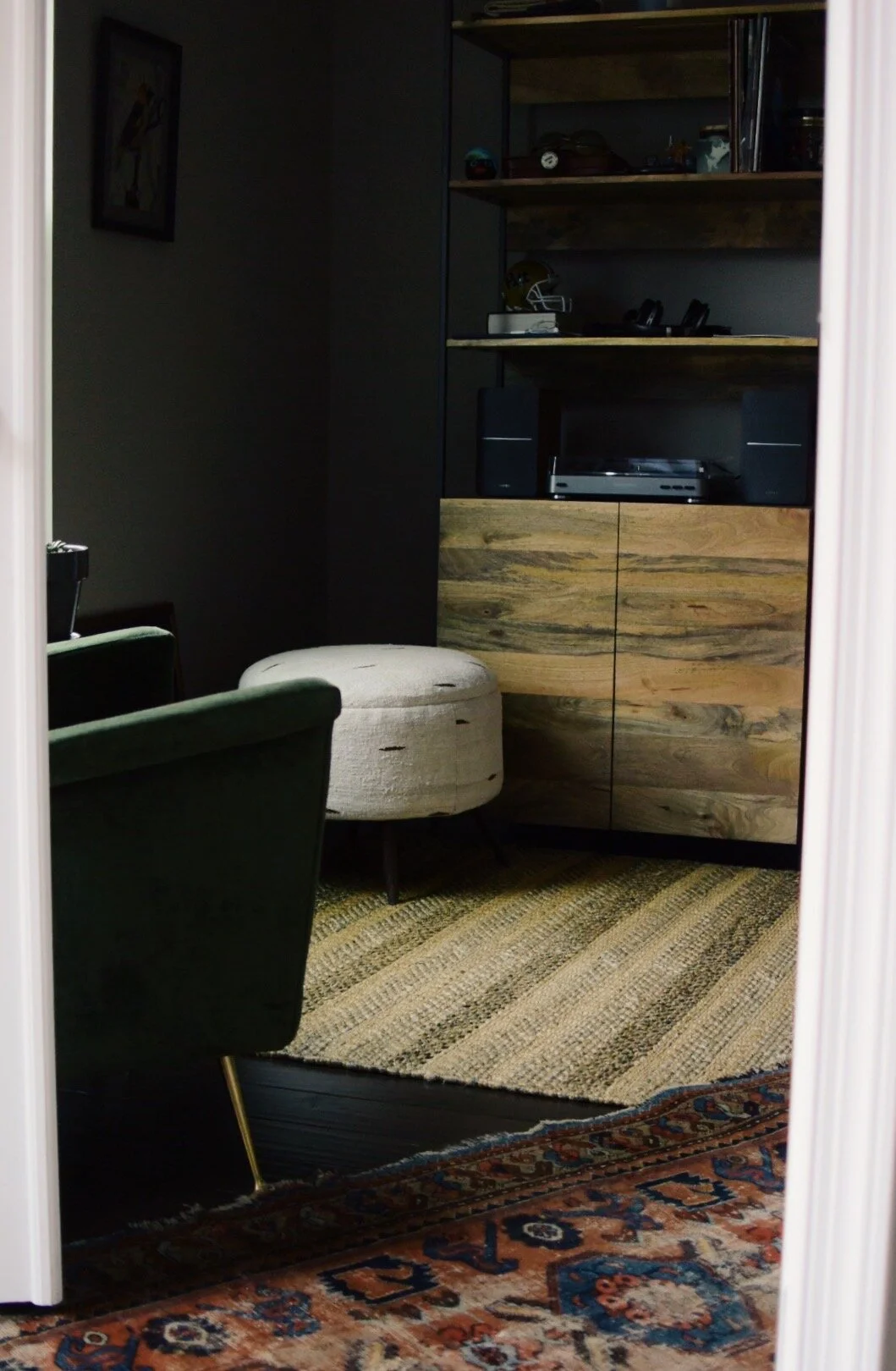  An antique Malayer sourced by Frances Loom, purveyors of fine antique rugs and accessories, adds to layers of texture in this space. 