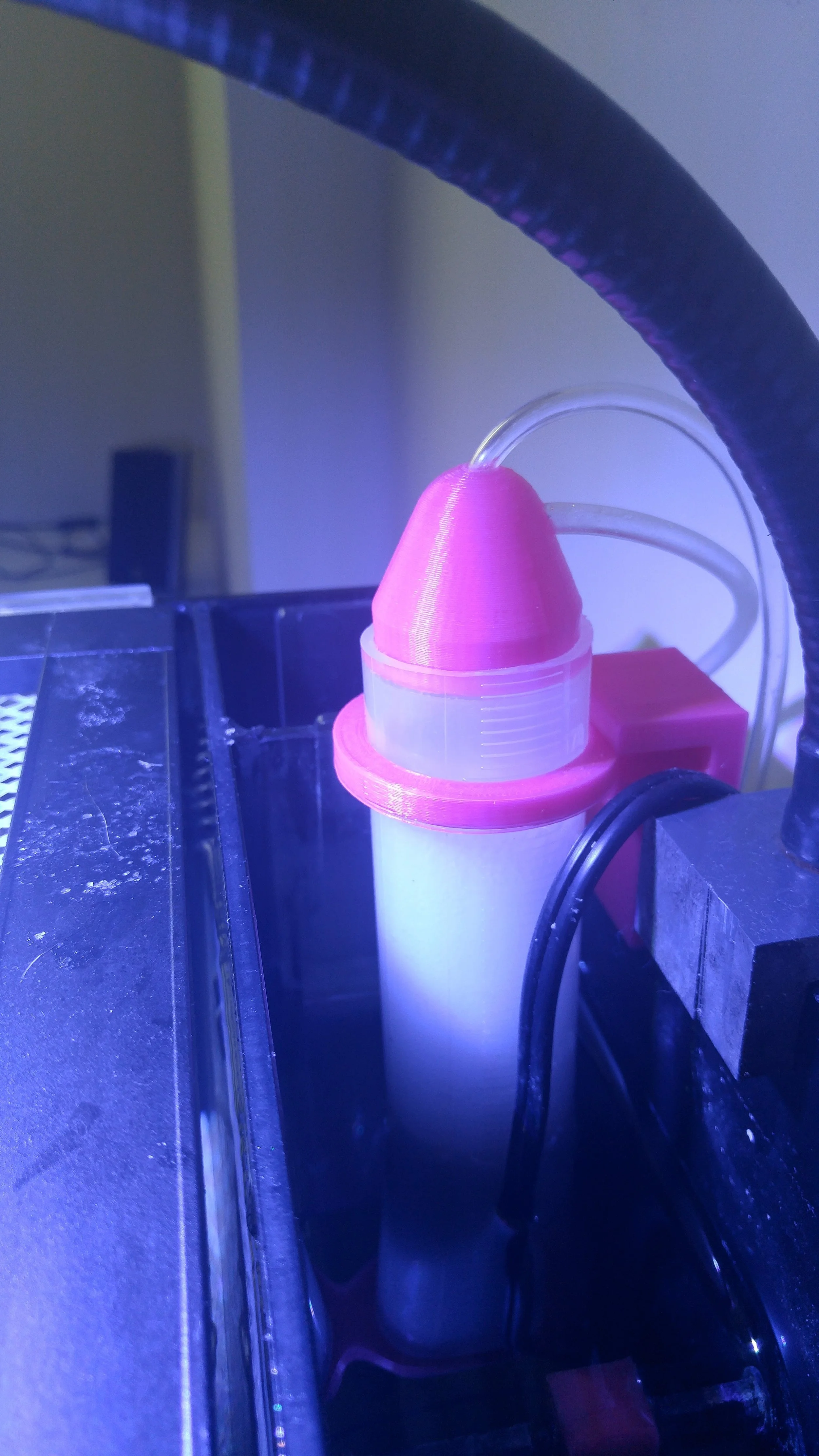 The protein skimmer sits in the rear chambers of the aquarium.