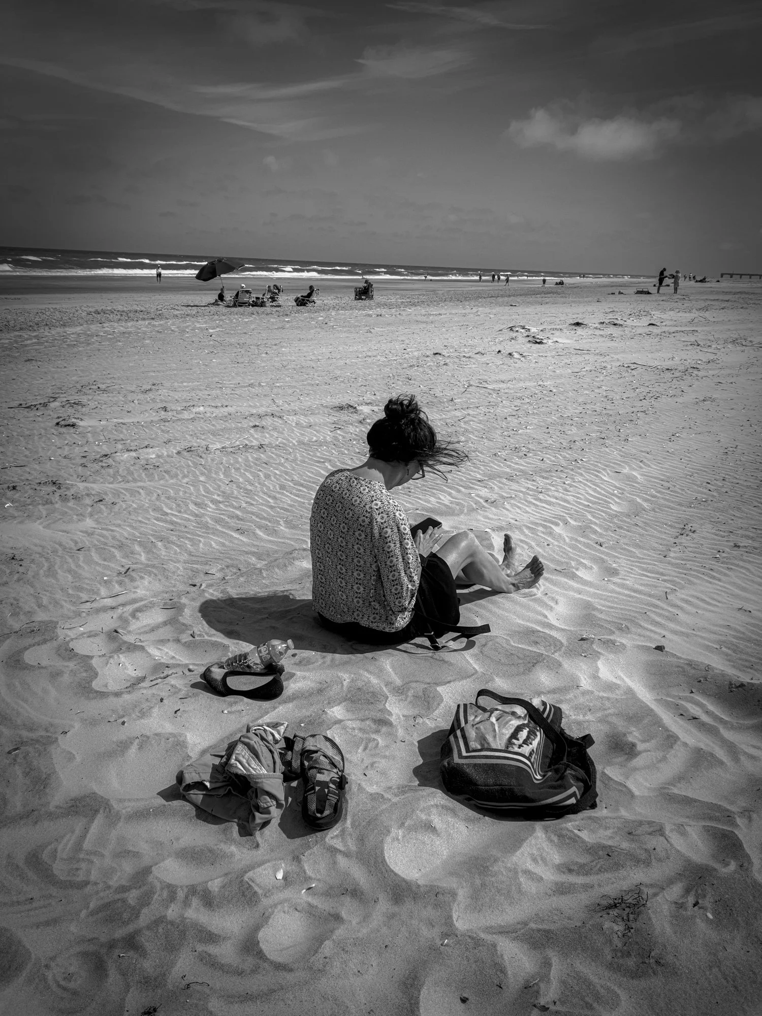 Heidi on the beach texting.jpg