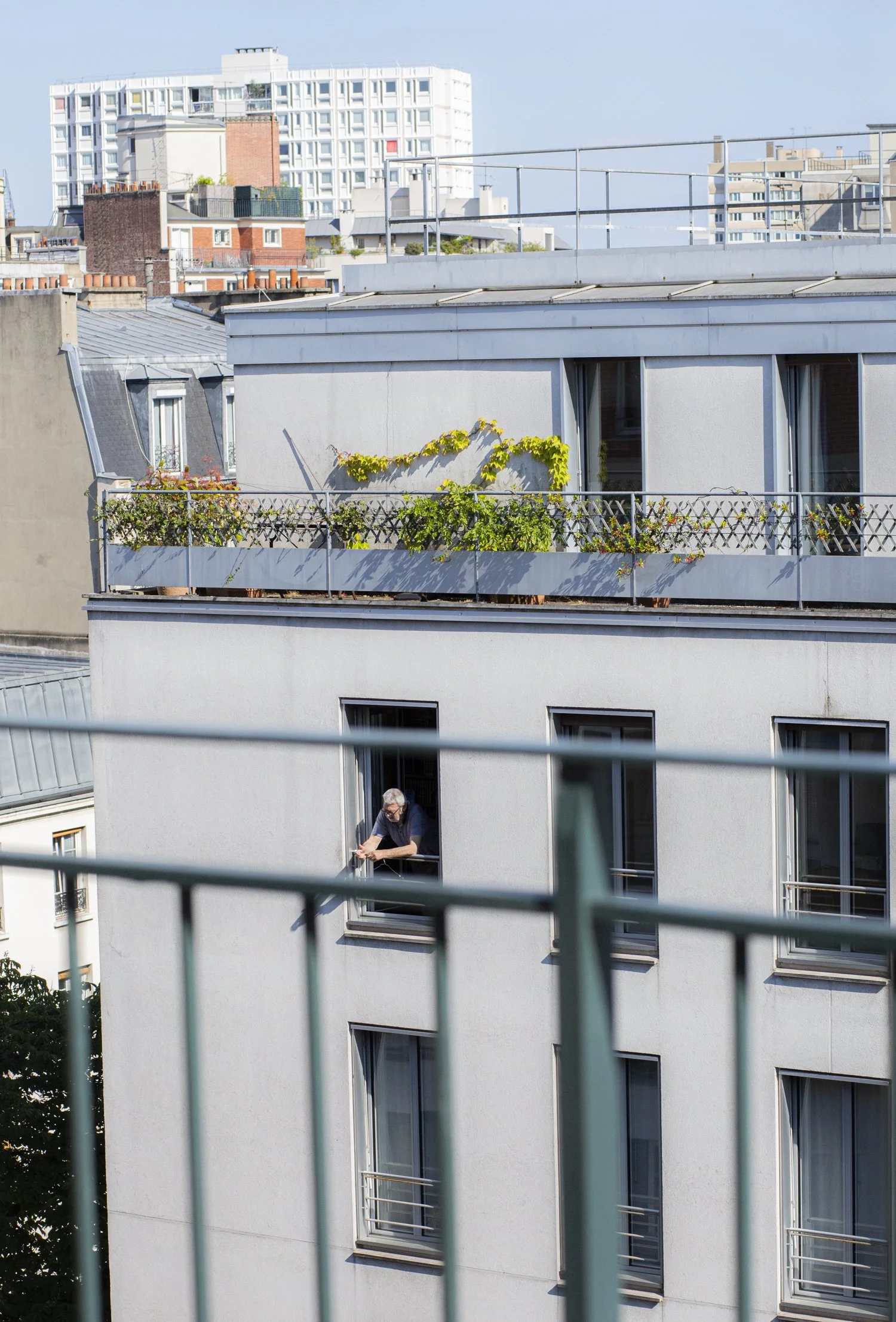 man in paris apartment window.jpg