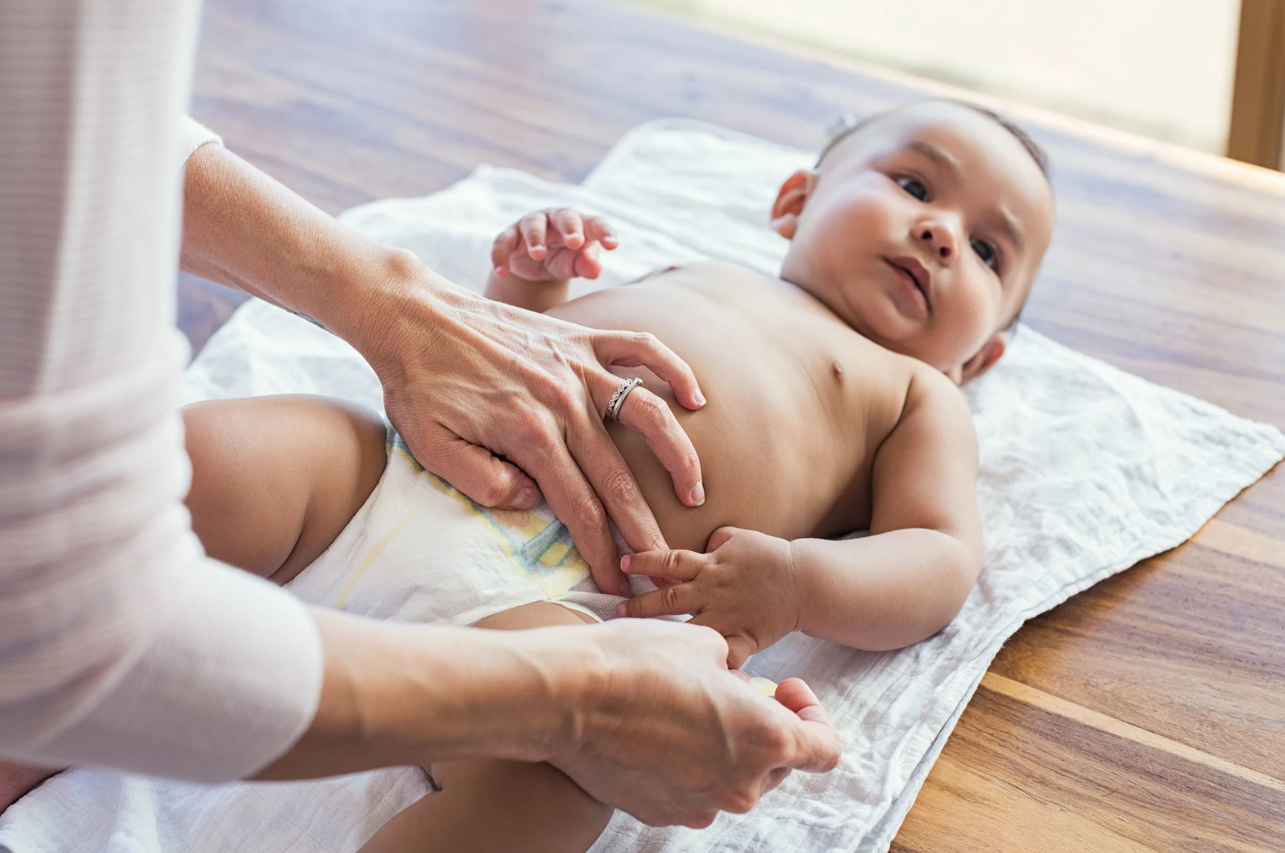 Baby having its diaper changed.