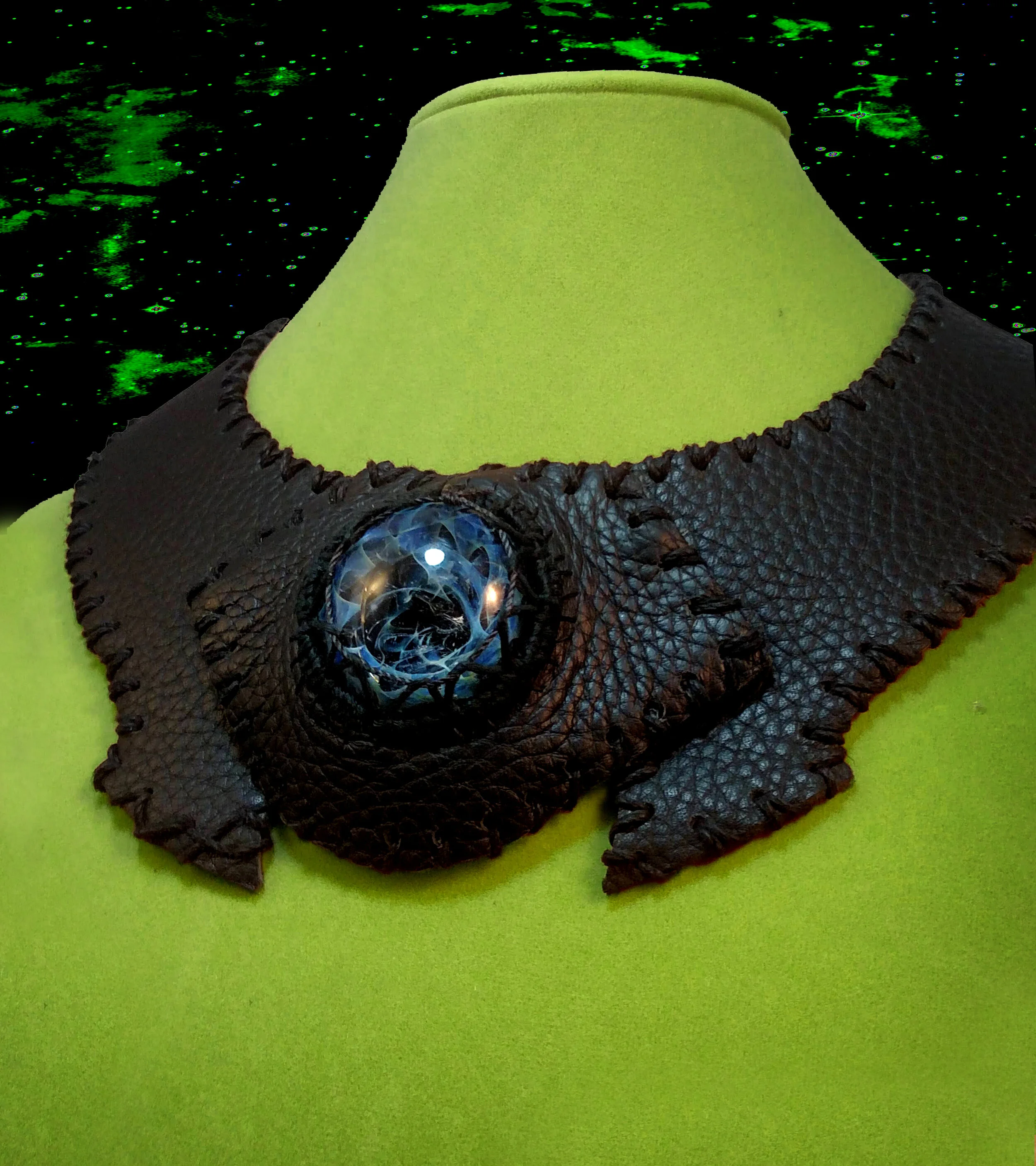 A collar made from leather, hemp, and glass. The glass is made by a friend, whose work can be found on Instagram @entropyglass