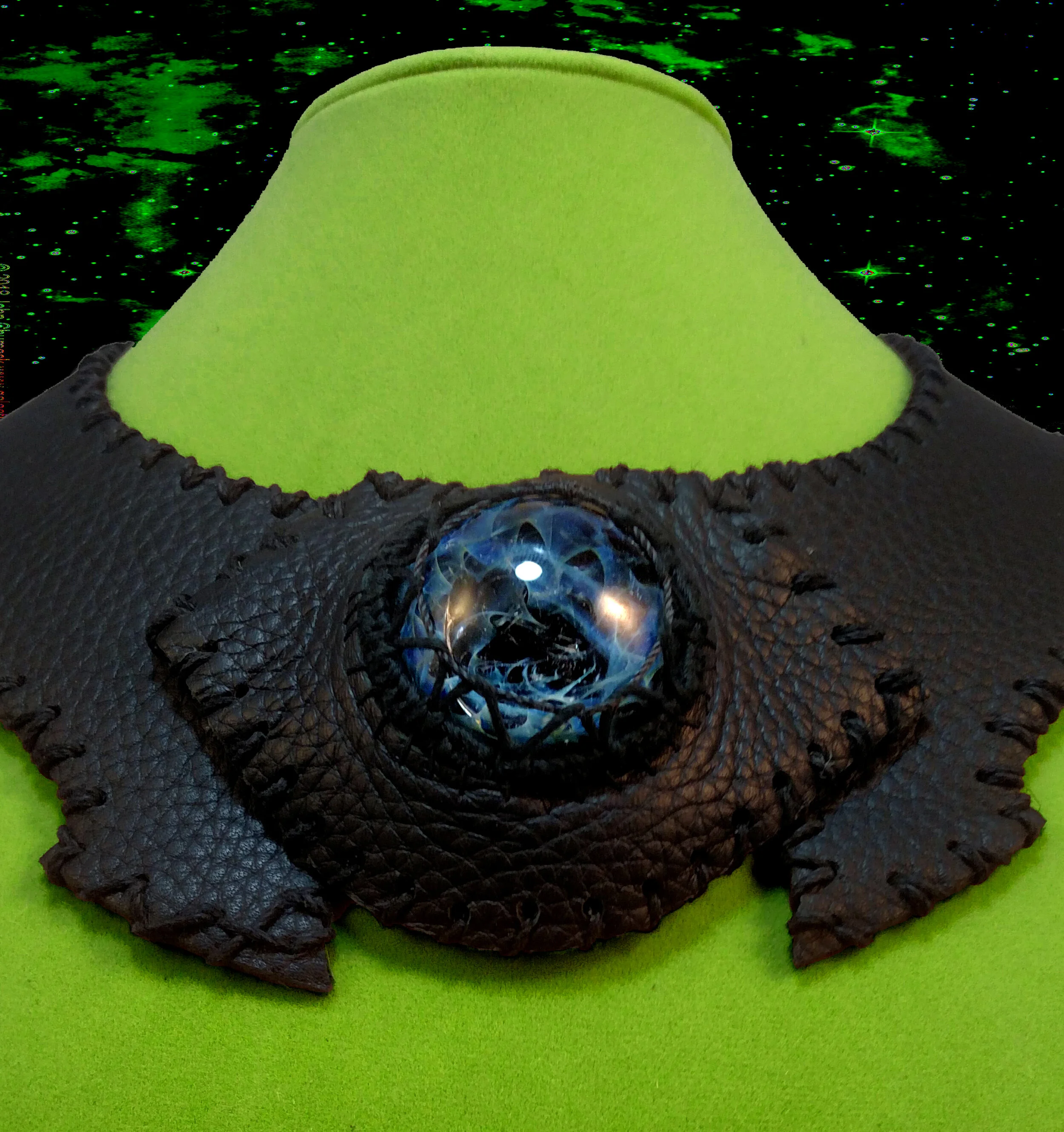 A collar made from leather, hemp, and glass. The glass is made by a friend, whose work can be found on Instagram @entropyglass
