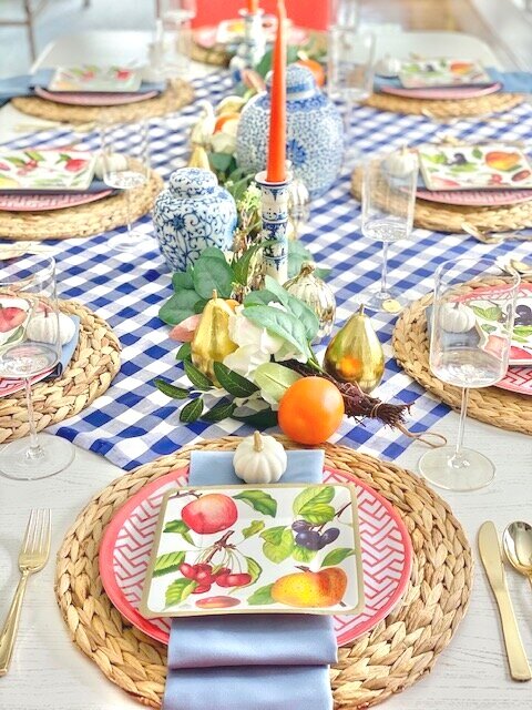 My favorite item to use down the middle of a table is a garland. This way I can reuse it in other parts of my house later on down the road. I love repurposing items for different decor in my home.