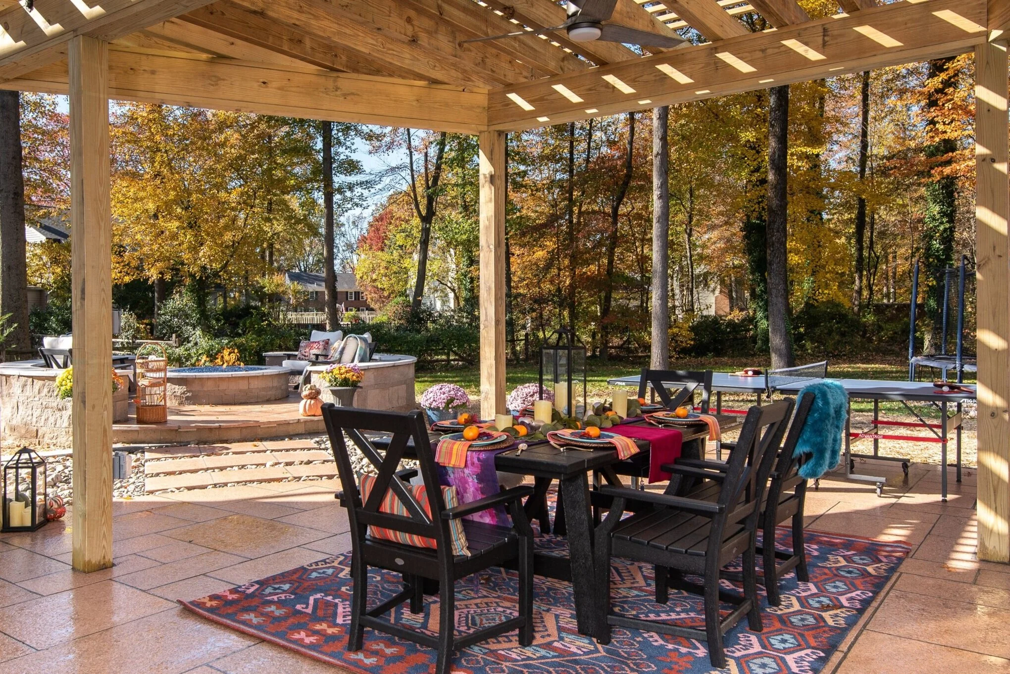 This view will never ever get old. Dining, firepit, ping pong table, trampoline, I mean we are good to go!