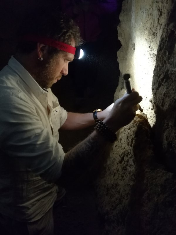 Dr Renaud Joannes-Boyau sampling in a dark cave (2017)