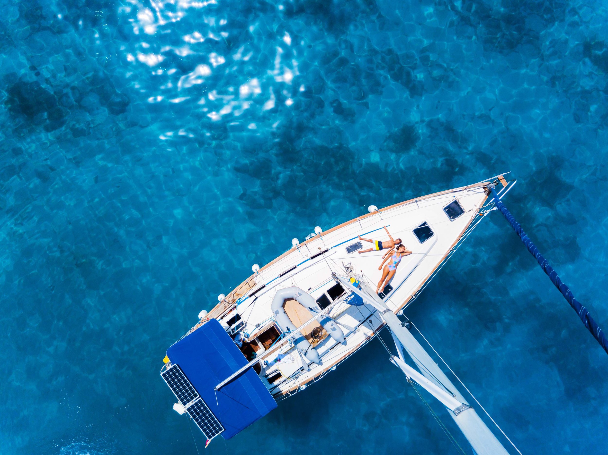 iStock-1016547228 aerial sailboat with kid.jpg