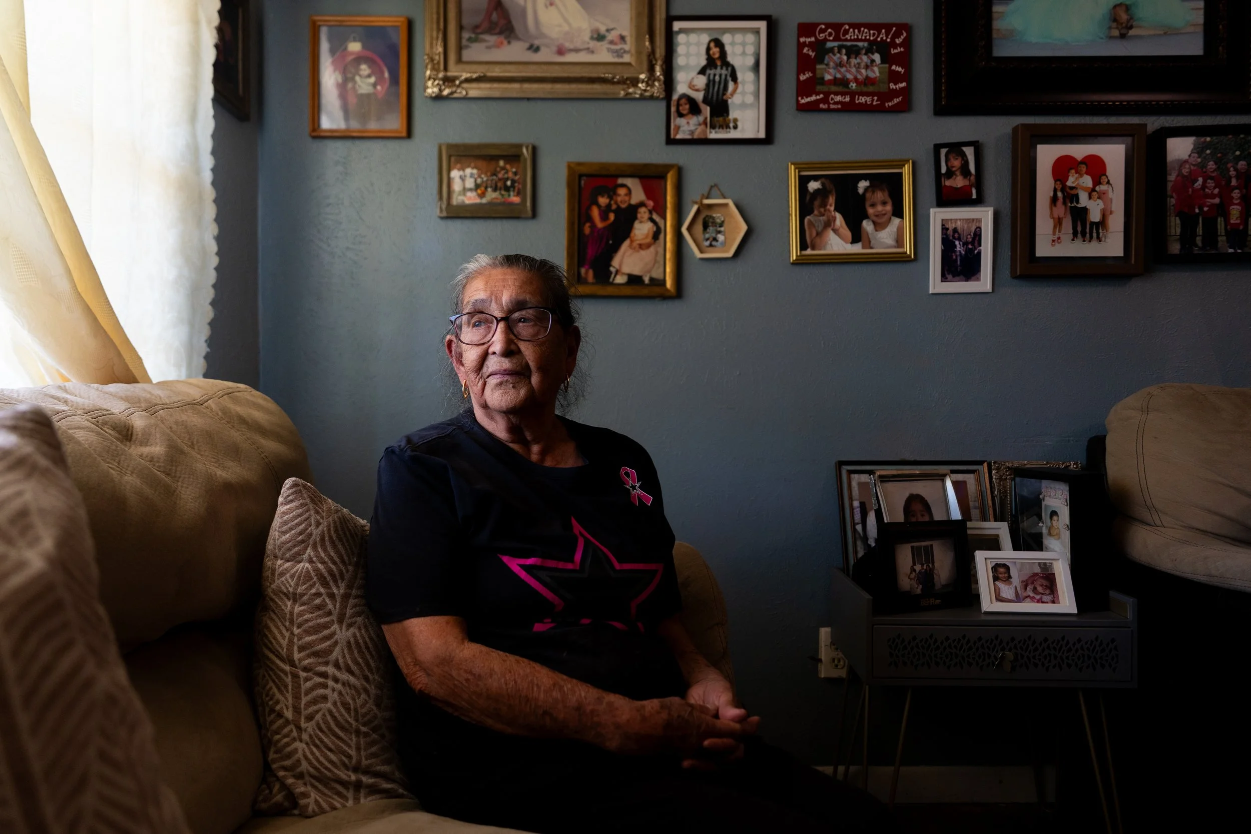 Maria Luz Lopez poses for a portrait in her living room in Lancaster, Texas, on Aug. 27, 2026. After moving to the United States in the 1960s, Lopez and her family moved to Dallas, Texas. During an interview, she shares memories of finding community 