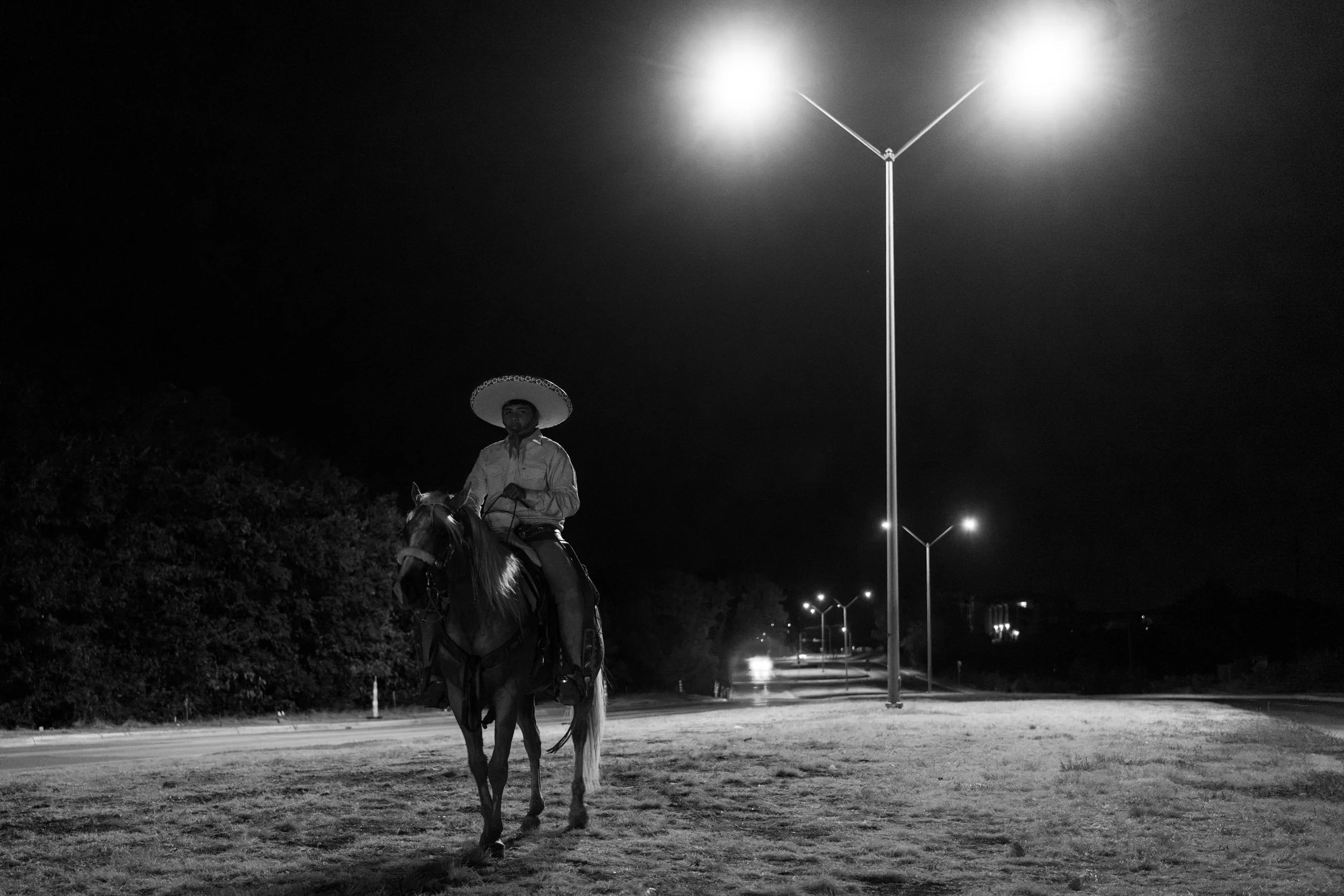 Emiliano rides down Angle Avenue in Fort Worth, Texas, at midnight Sept. 5, 2026. 