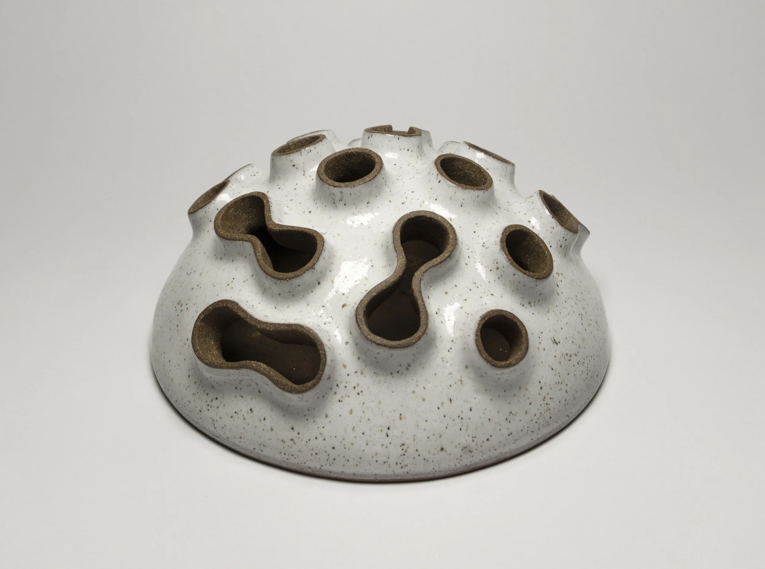  dark stoneware with glossy white glaze,  w.12” x h.5” 