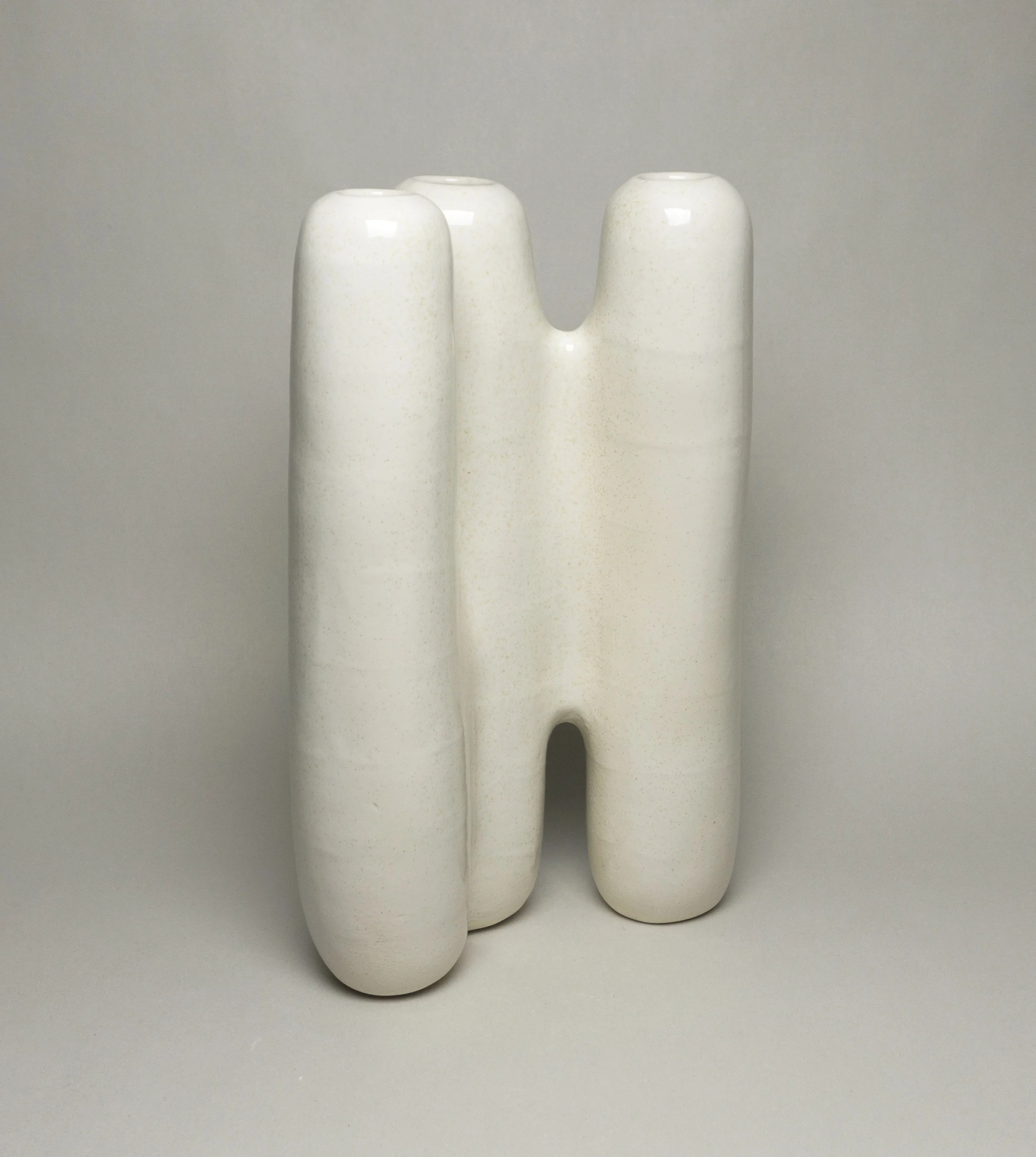 stoneware with glossy white tan-flecked glaze,  h.13.5” 
