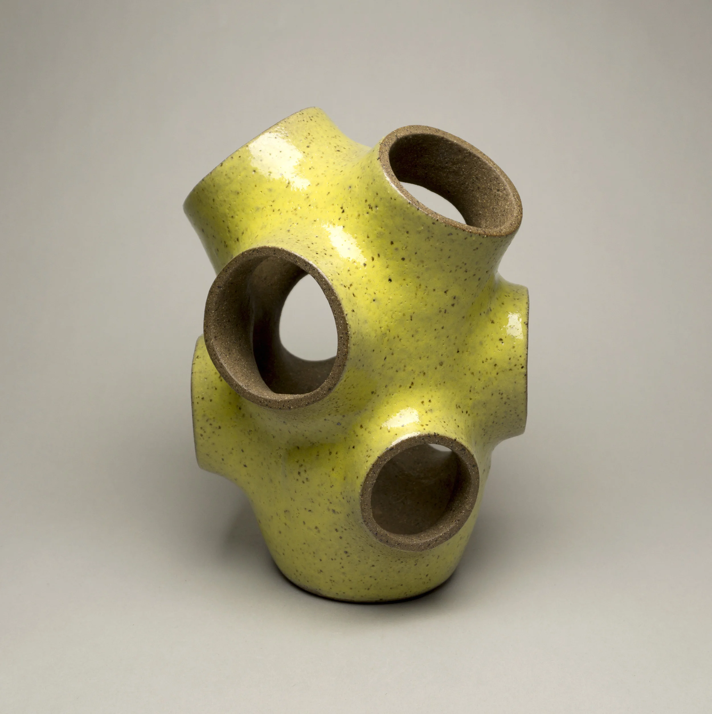  dark stoneware with glossy yellow glaze,  h.10” 