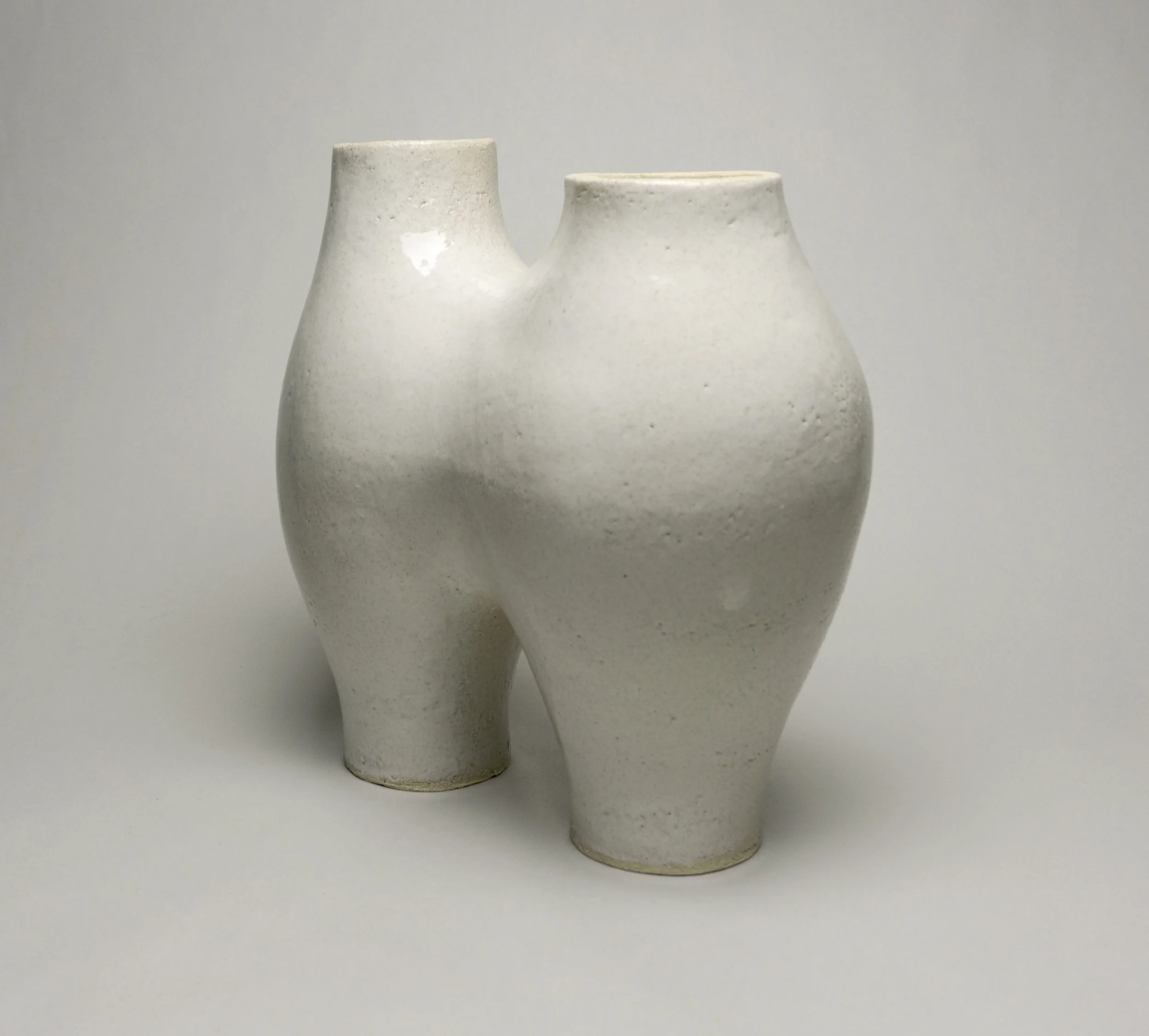  stoneware with glossy white tan-flecked glaze,  h.11.5” x w.11” 