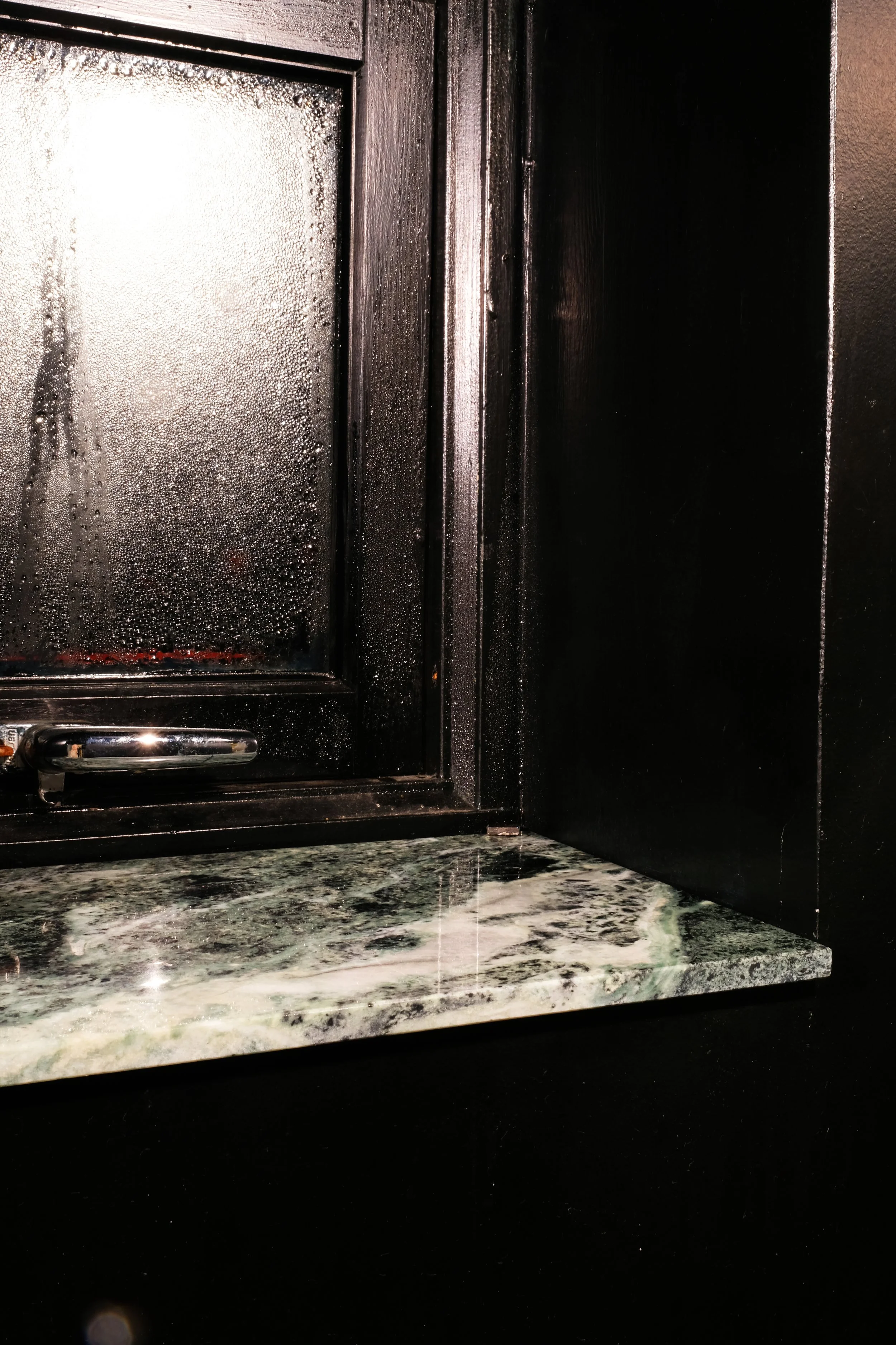  Marmo Verde Guatamala! The bathroom in black gives you a relaxing mood, turn down the light and you feel your are in a dark cave.