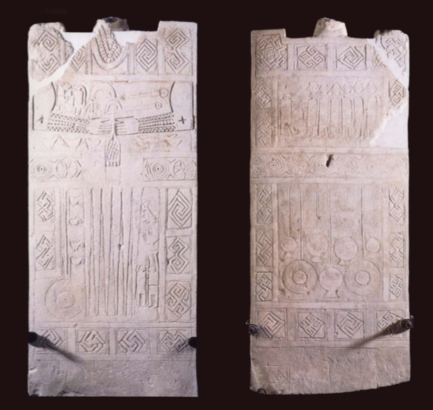 Female Daunian stela, with decorated arms, a necklace, fibulae, various pendants and an apron on the front, and pendants suspended from a belt on the back.