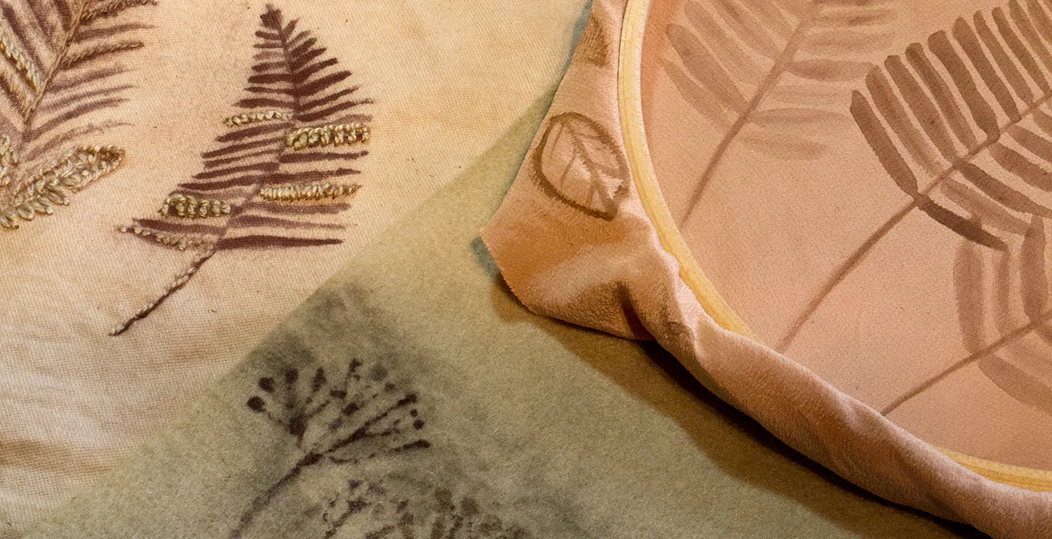 Iron oxide painted designs on natural dyed fabric