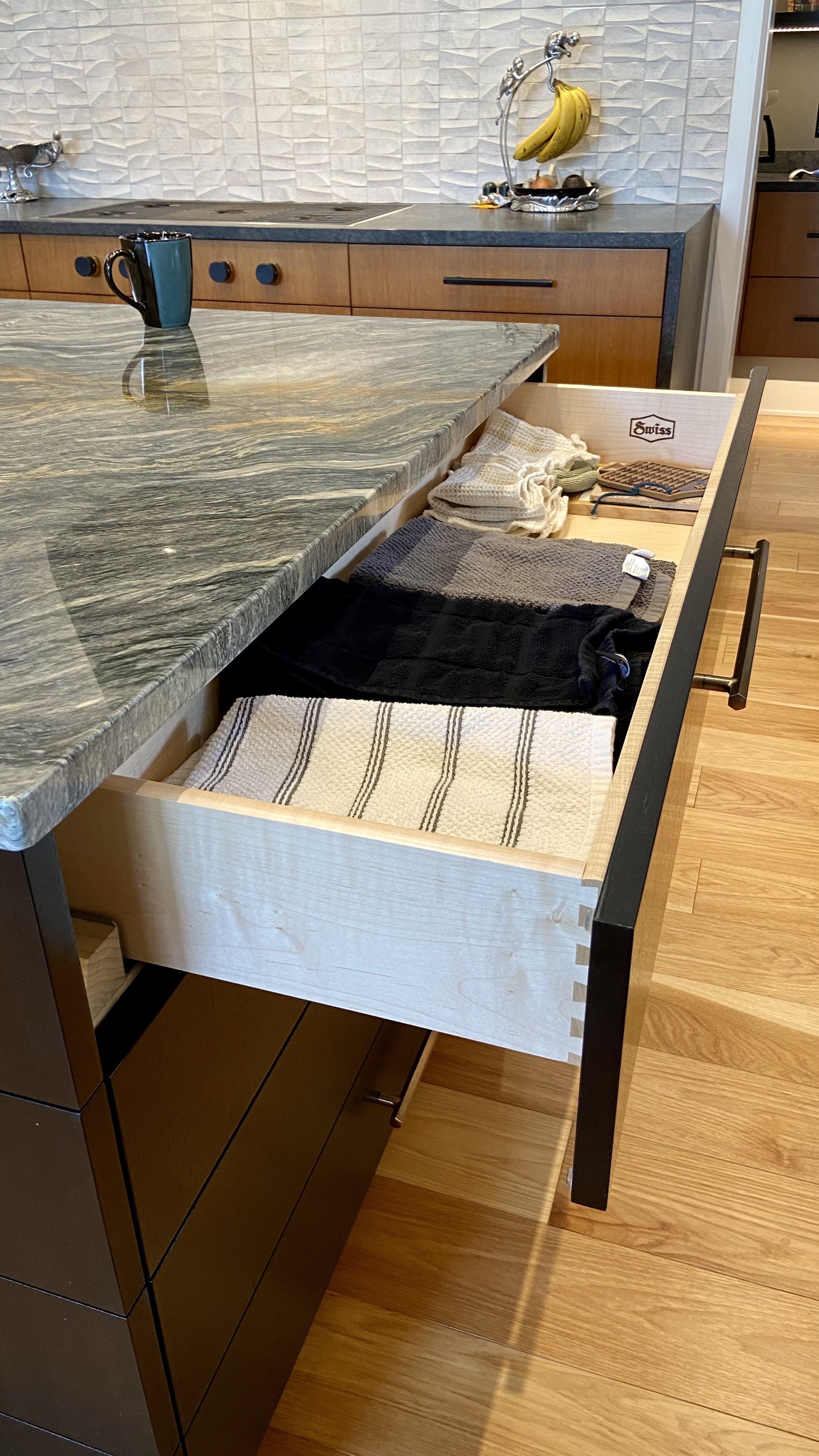 Custom wood kitchen drawer with precise dovetail joint.