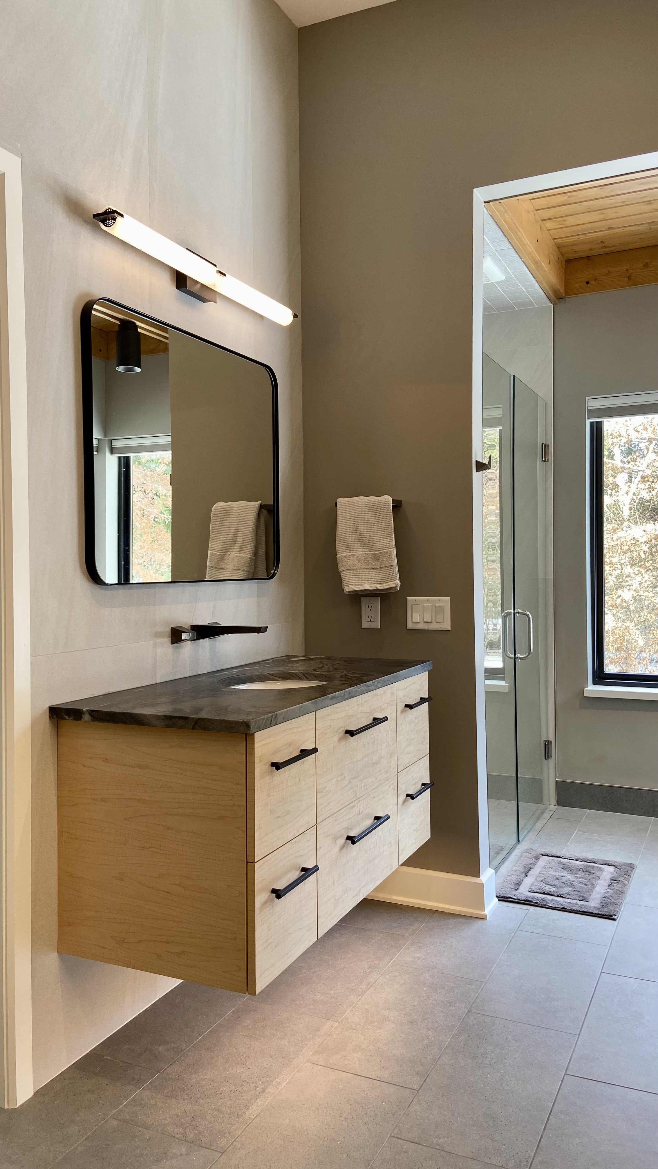 Custom wood floating bathroom cabinet.