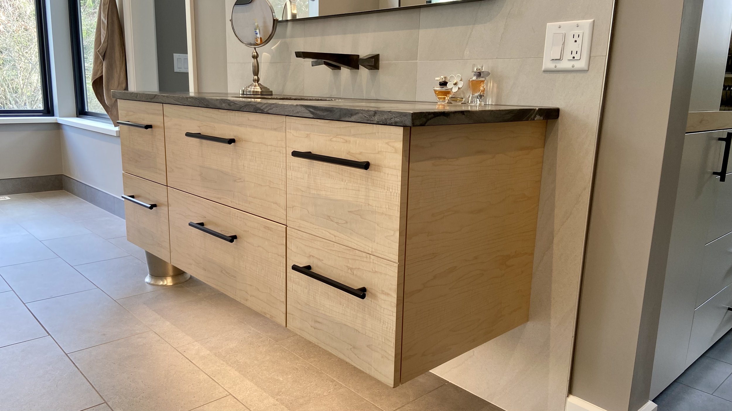 Custom wood floating bathroom cabinet.