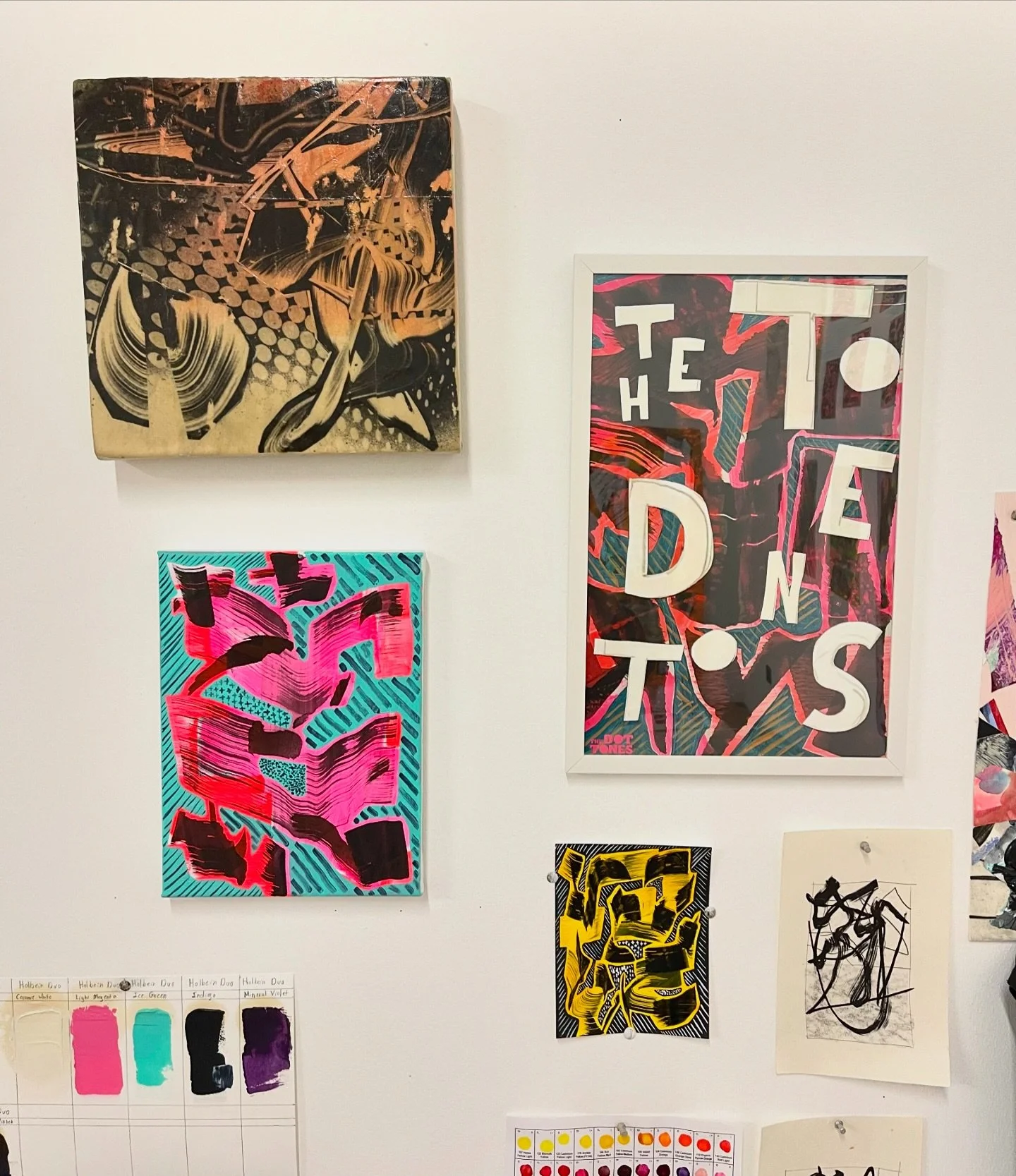 Studio wall. Top left is from 2011. I try to keep older work up as a reminder. Below is from 2024 I try to keep things out and hanging together so I can see relationships over time. The sketches on the lower right are from 2008.