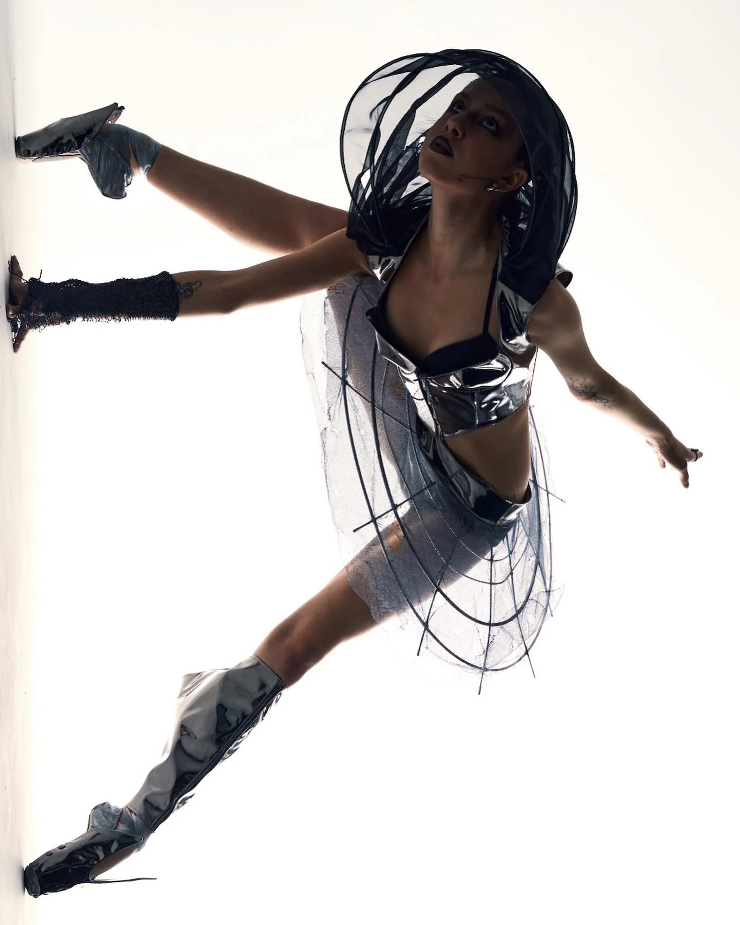  Metal tutu   Metallic netting with burn holes   Mirrored vinyl bustier with mobile 6 layer organza &amp; wire hood     