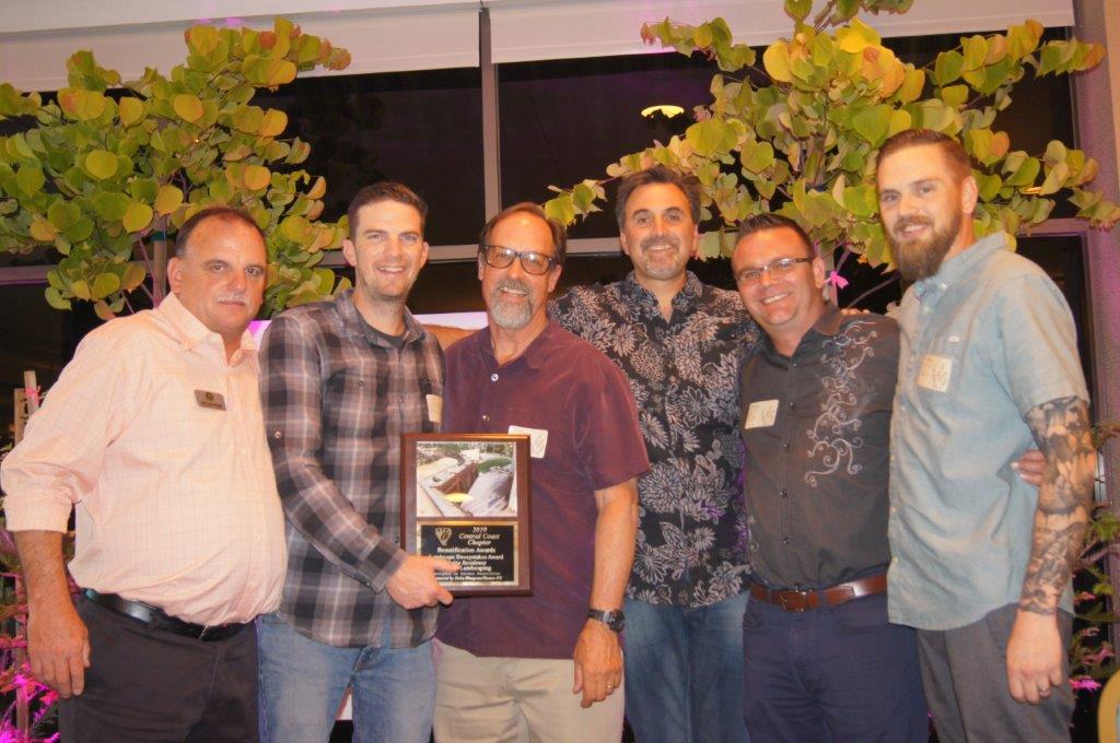 The K & D Landscaping team picks up the Landscape Sweepstakes Award