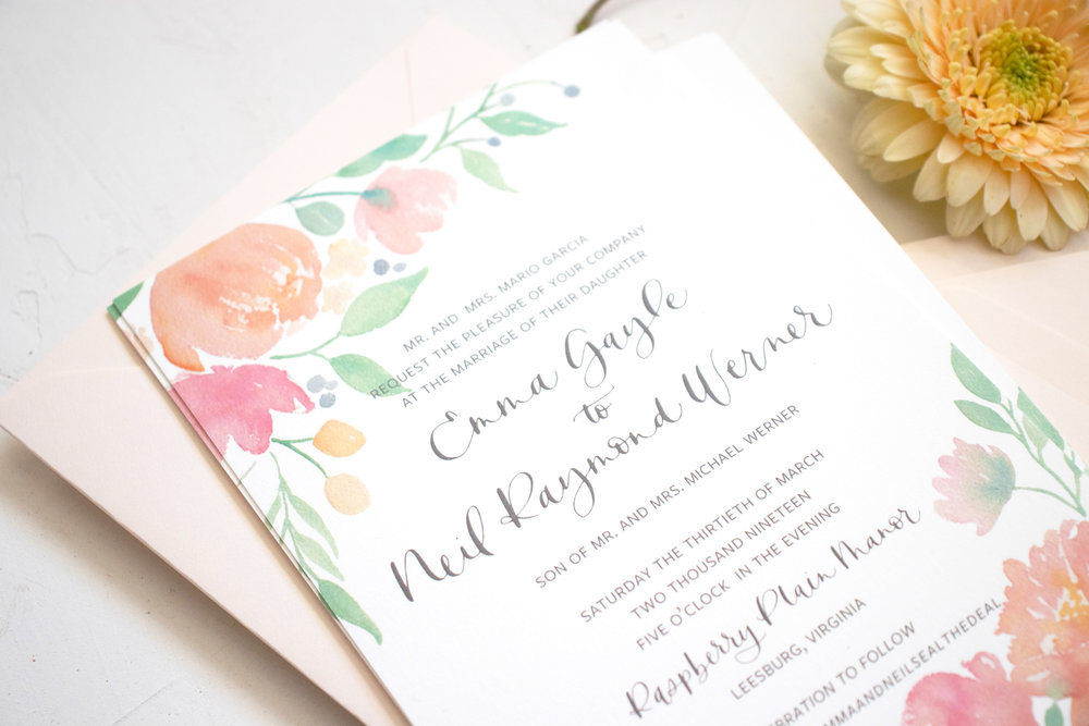 Watercolor floral wedding invitation in shades of coral and pink
