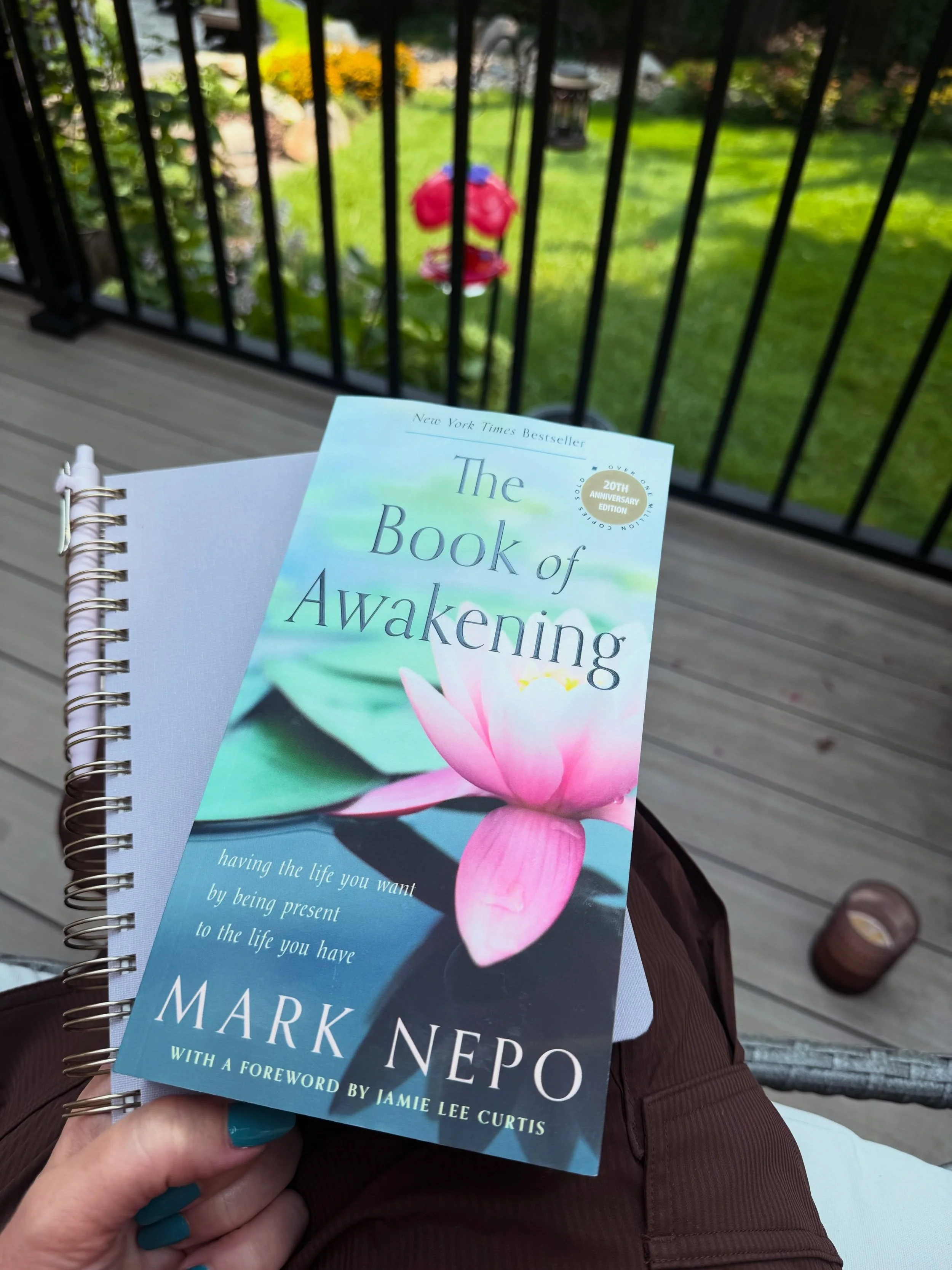 Summer mornings on the deck have become one of my favorite rituals. ☀️🌿

I settle into my swinging chair with my iced coffee, my journal, and whatever page is waiting for me in The Book of Awakening. 📖🧊☕️

The hummingbirds are usually busy at the 
