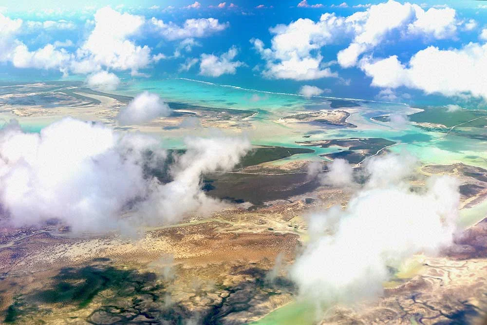 The Turks & Caicos Islands, home to a huge barrier reef, are absolutely gorgeous to marvel at from the sky. Book a window seat on your flight if you can.