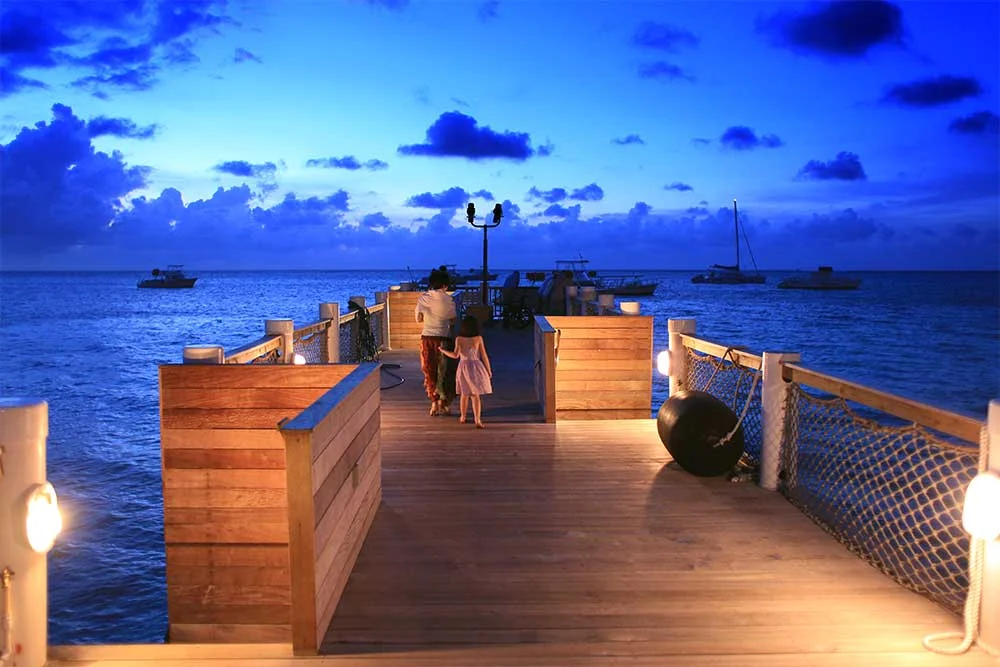 The watersports pier in the Caribbean Village is transformed into a barracuda-watching vodka bar in the evening. It’s a beautiful place to watch the sunset above and the tropical fish below.