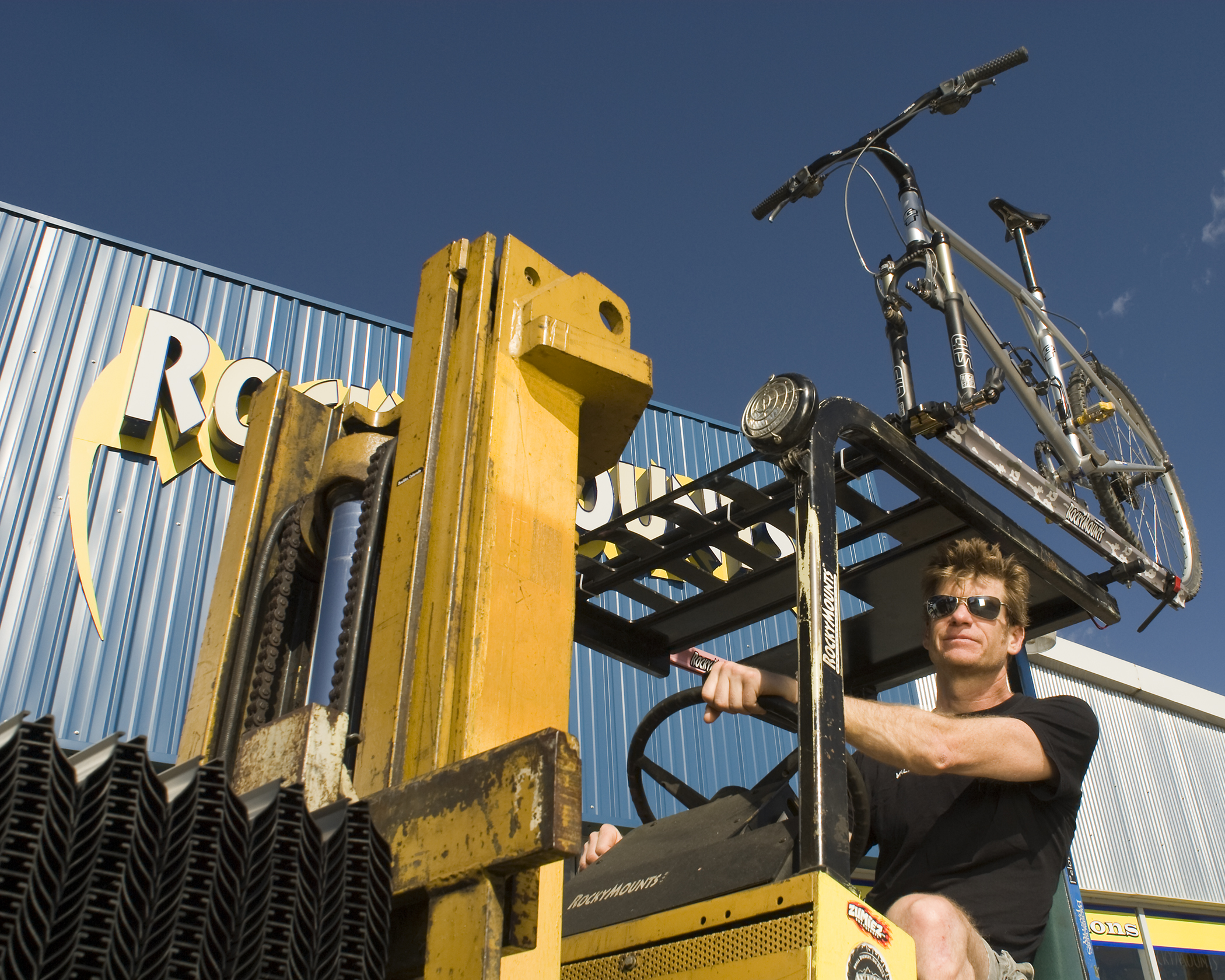  Bobby, his GT and his forklift outside of Rocky Mounts for the My Favorite Bike Portrait Series. 